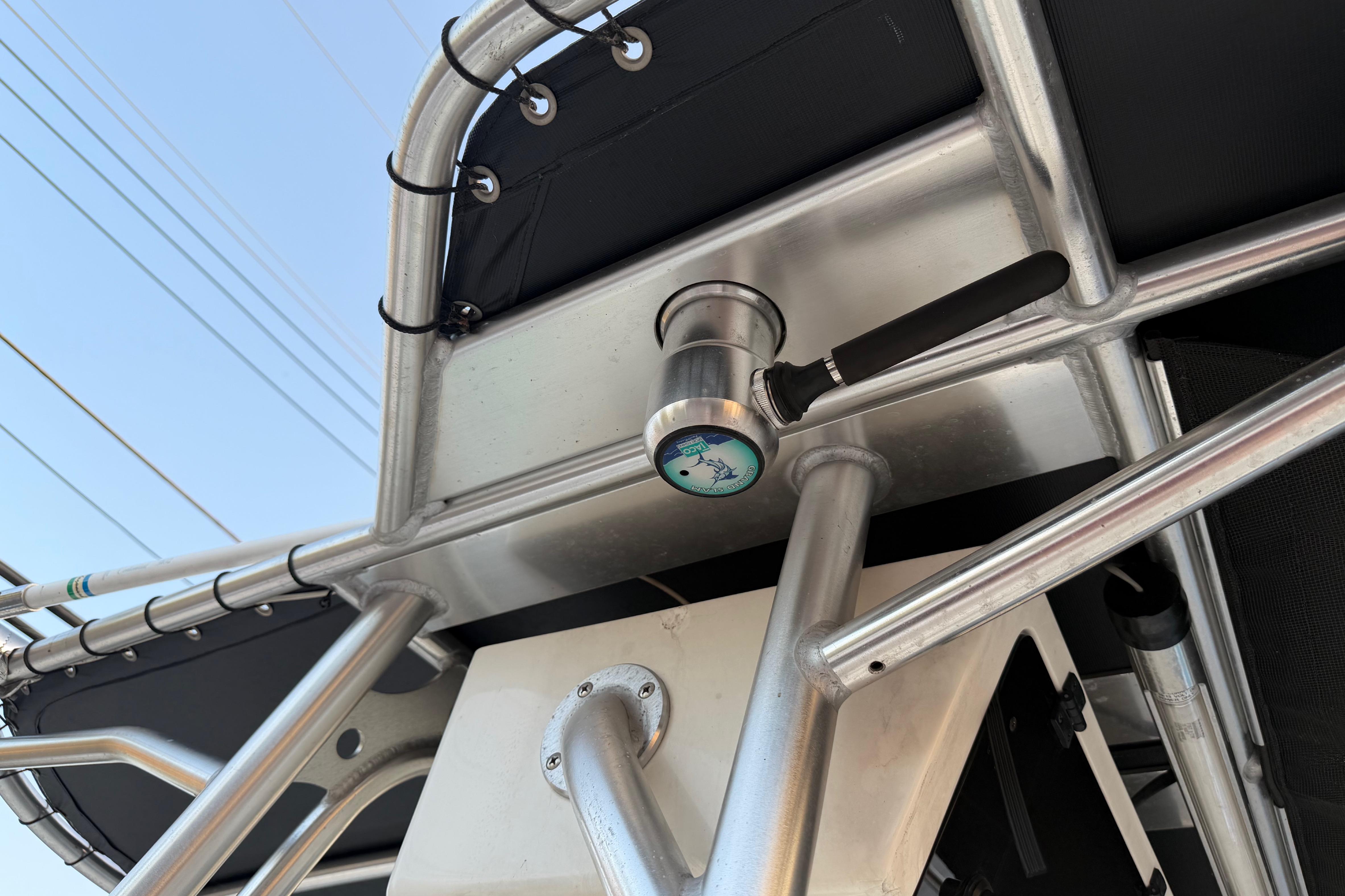 Close-up of a 2007 Mako 234 Center Console boat's metal framework and gauge.