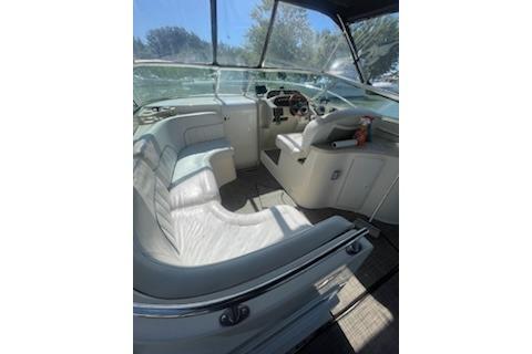 2000 Rinker Fiesta Vee 310 boat interior with seating and steering area.