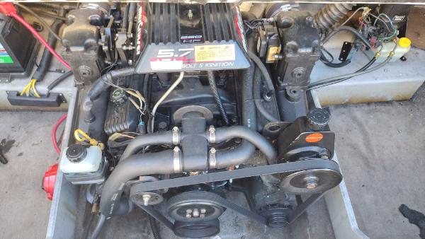 1999 Chaparral 2130 SS engine compartment with visible 5.7L V8 engine components.