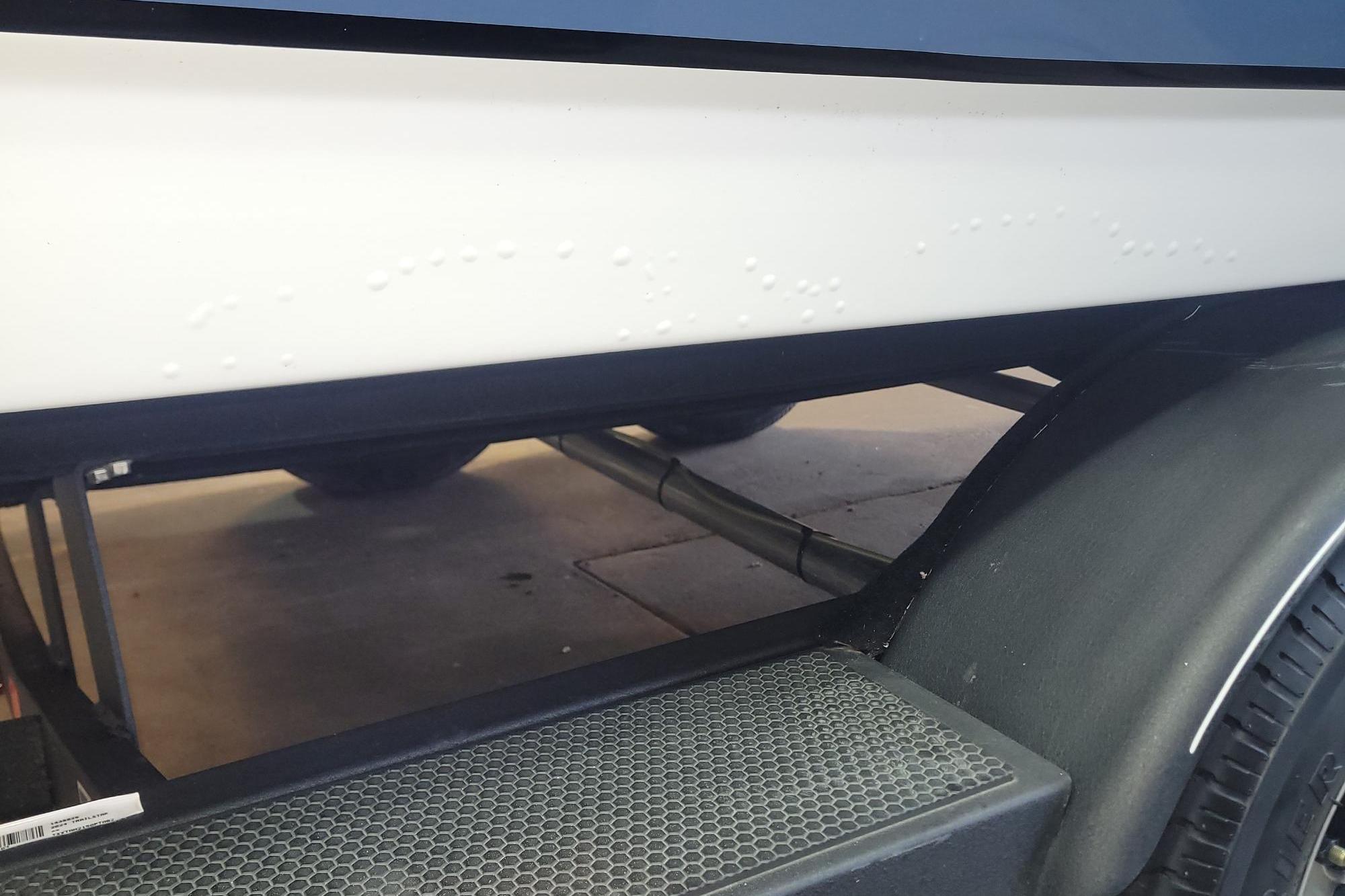 2024 Tahoe 2150 CC boat hull with visible surface imperfections on trailer.
