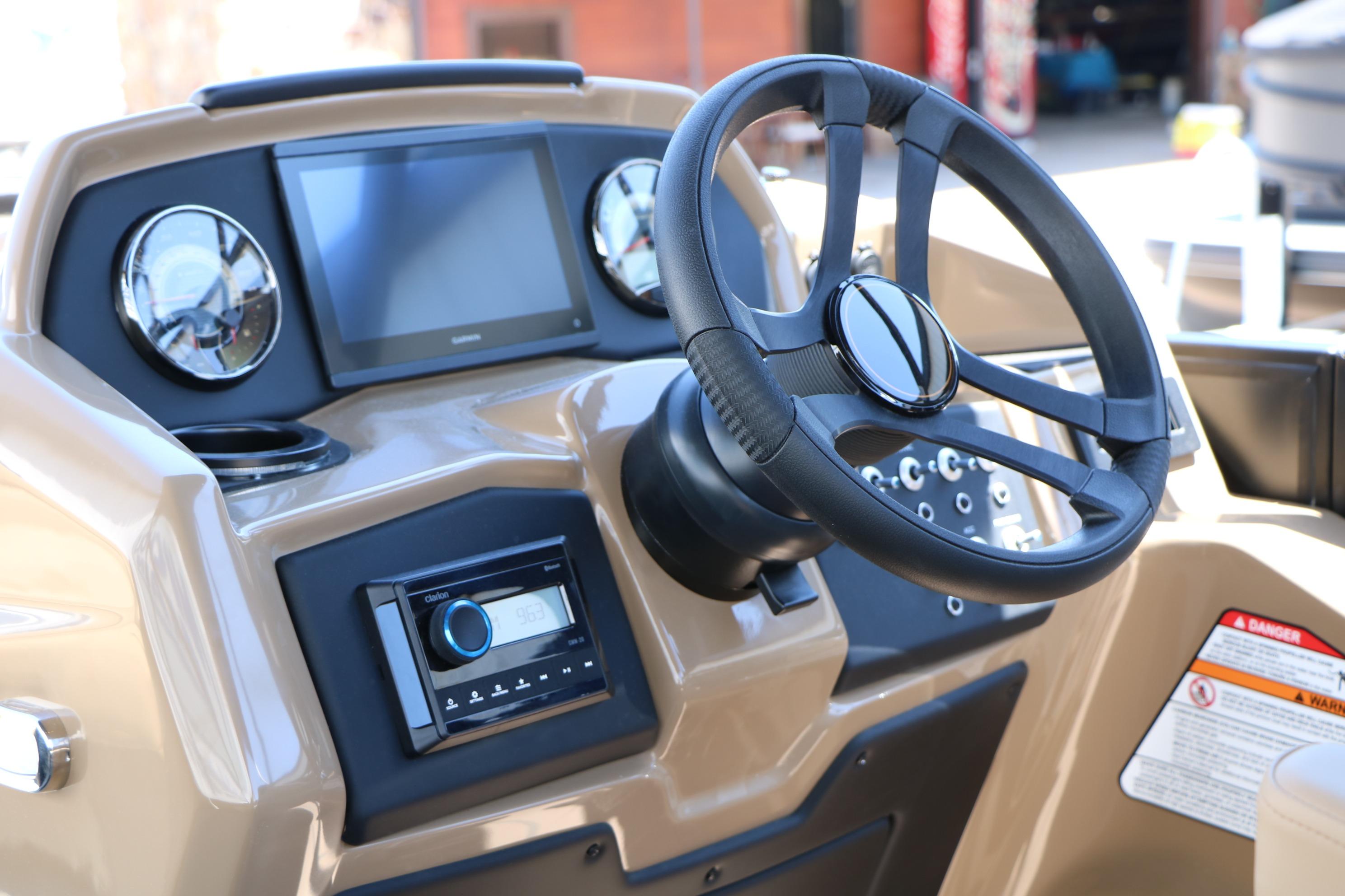 2026 Evotti 521CS boat dashboard with steering wheel and modern controls.