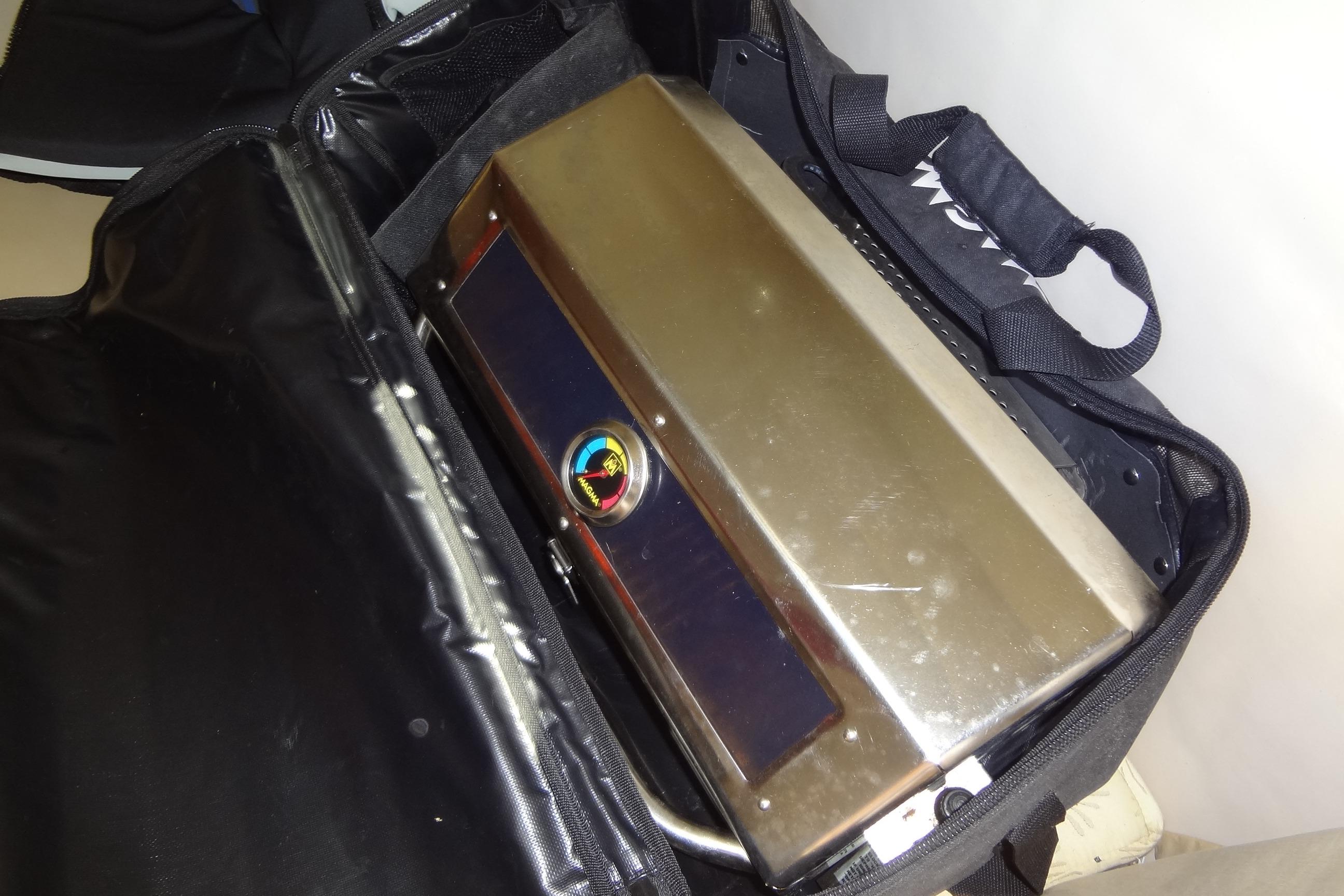 Bag containing a metallic device with a colorful emblem, related to Chaparral Signature 260, 2000 model.
