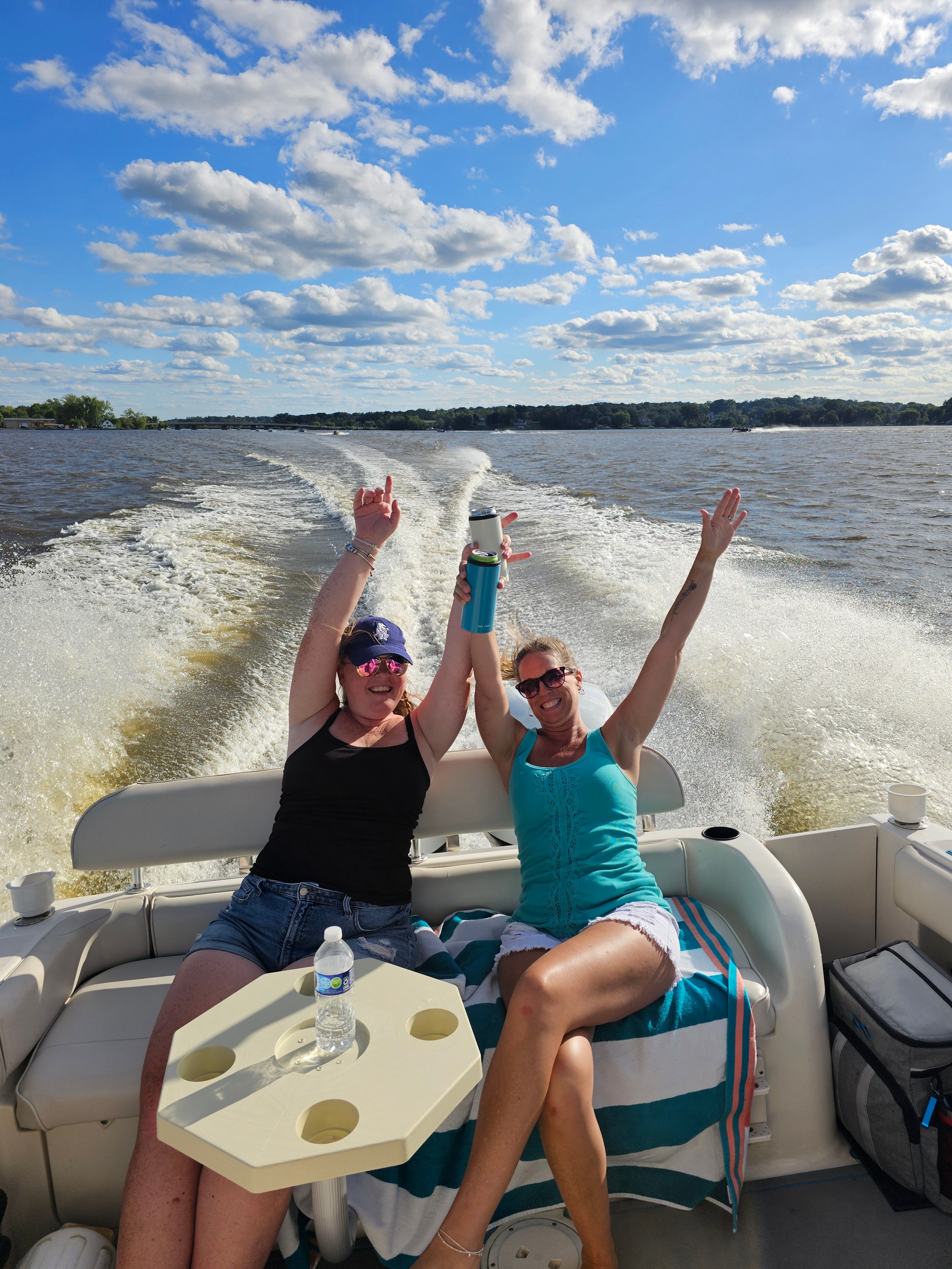 Two women enjoying a boat ride on a 2005 Robalo R265 Walkaround.