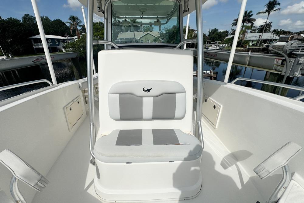 2018 Mako 284 Center Console boat interior with seating and console view.
