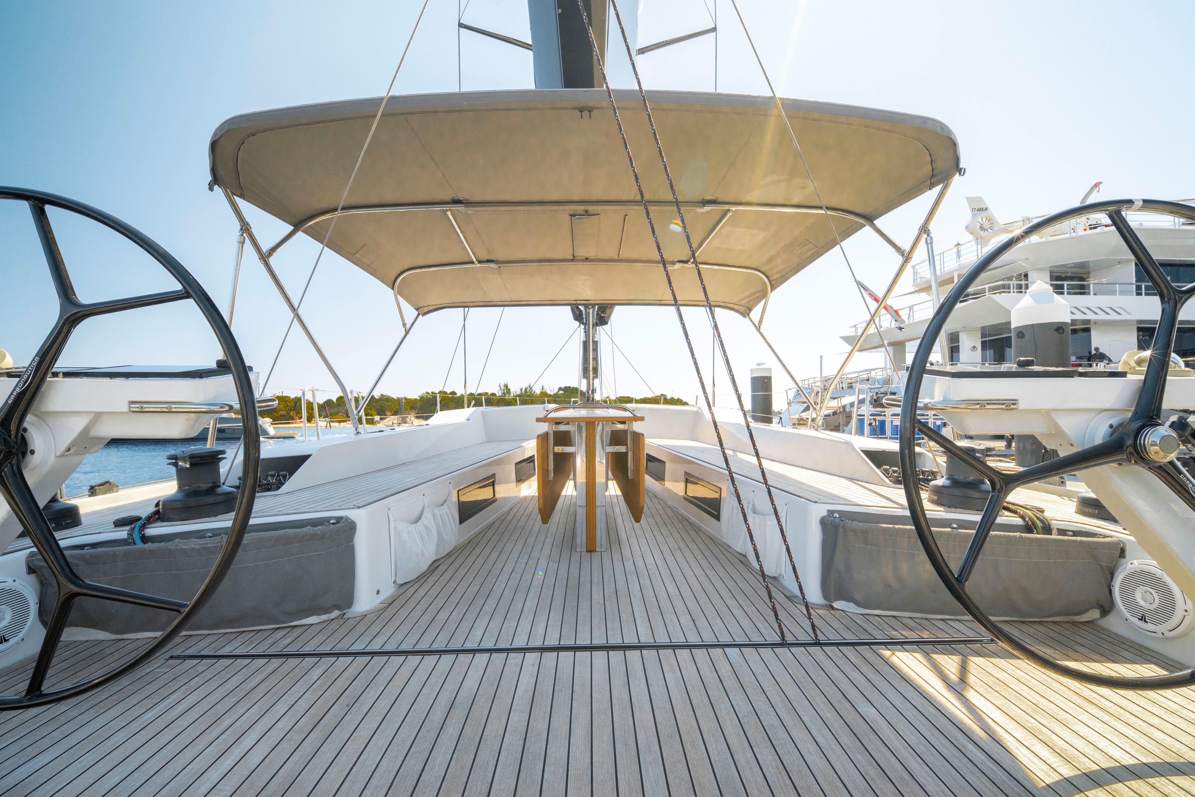 Luxury Grand Soleil 58 yacht deck, 2016 model, featuring dual steering wheels and spacious seating.