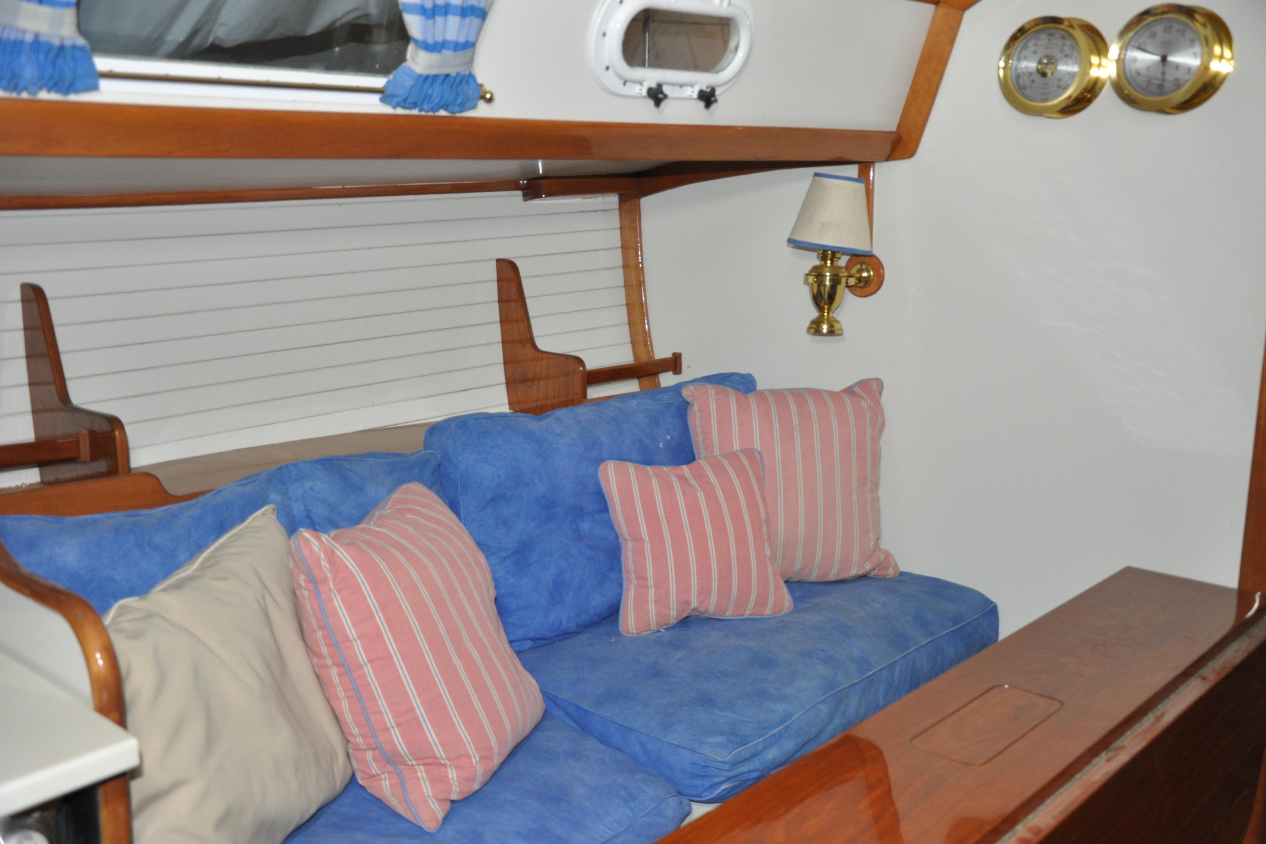 Interior of 1970 Hinckley Bermuda 40 with blue and striped cushions.