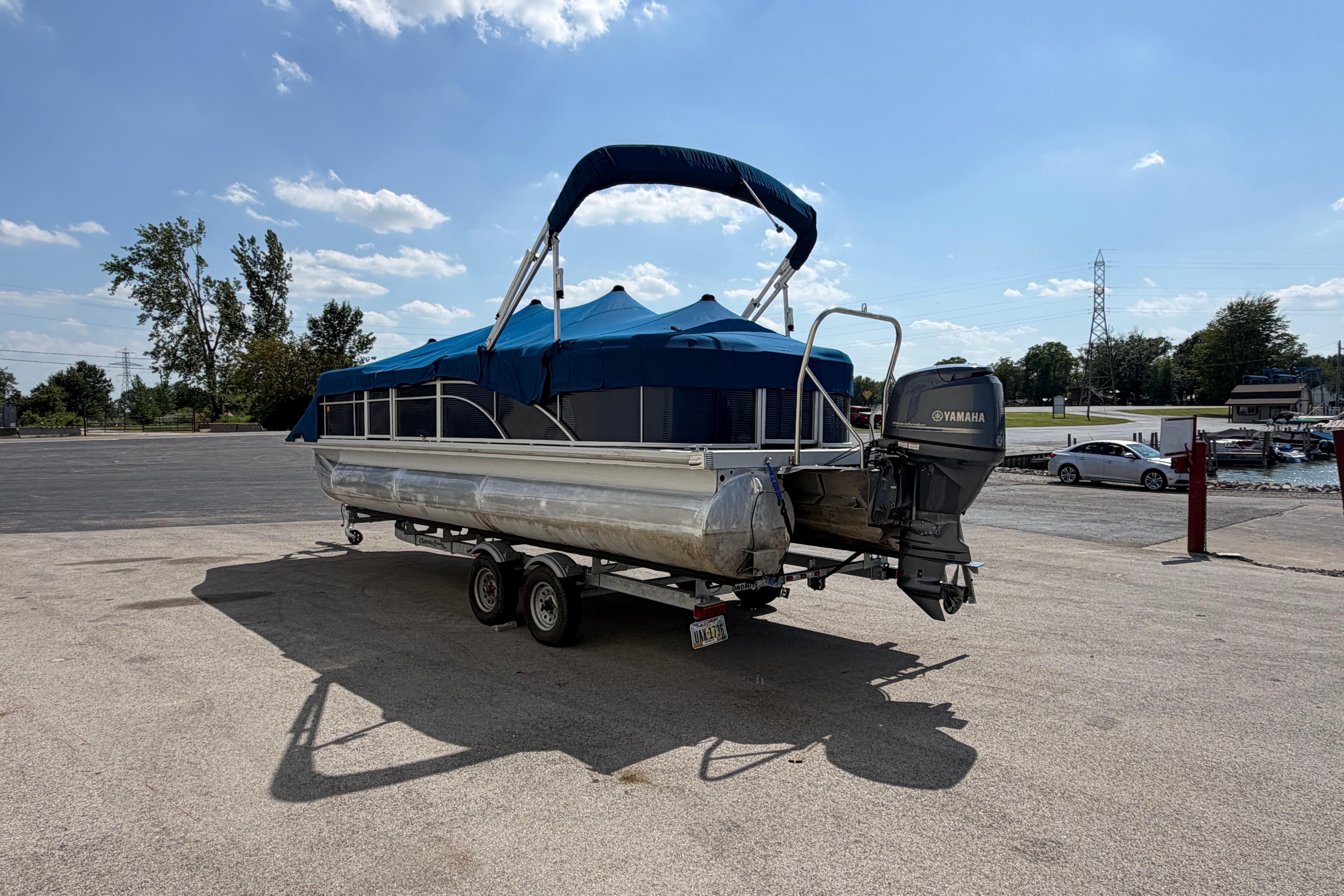 2017 Bennington 25 SSXAPG pontoon boat with Yamaha motor on trailer.