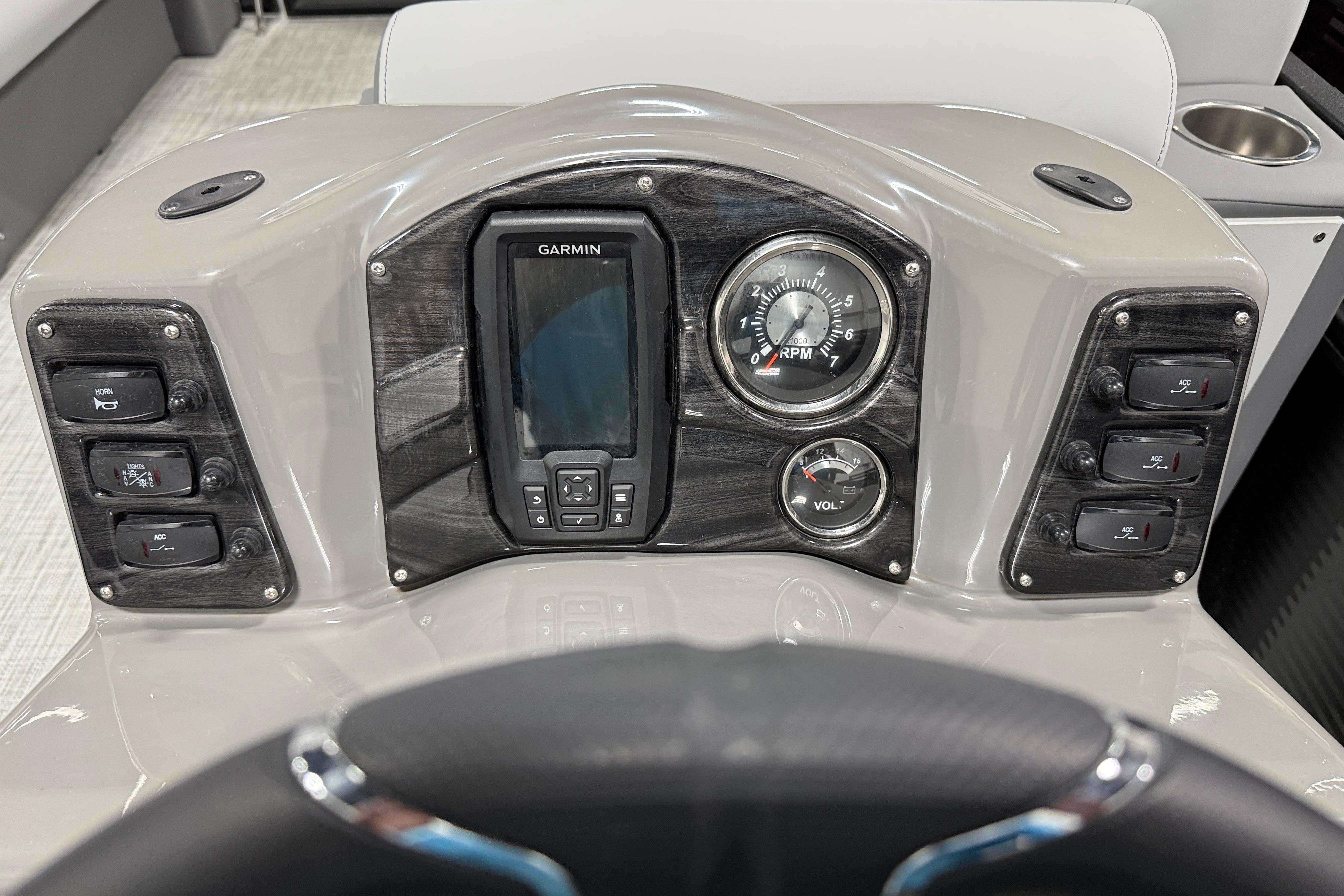 Dashboard of 2026 Angler Quest 818 Panfish Cruise with Garmin display and RPM gauge.