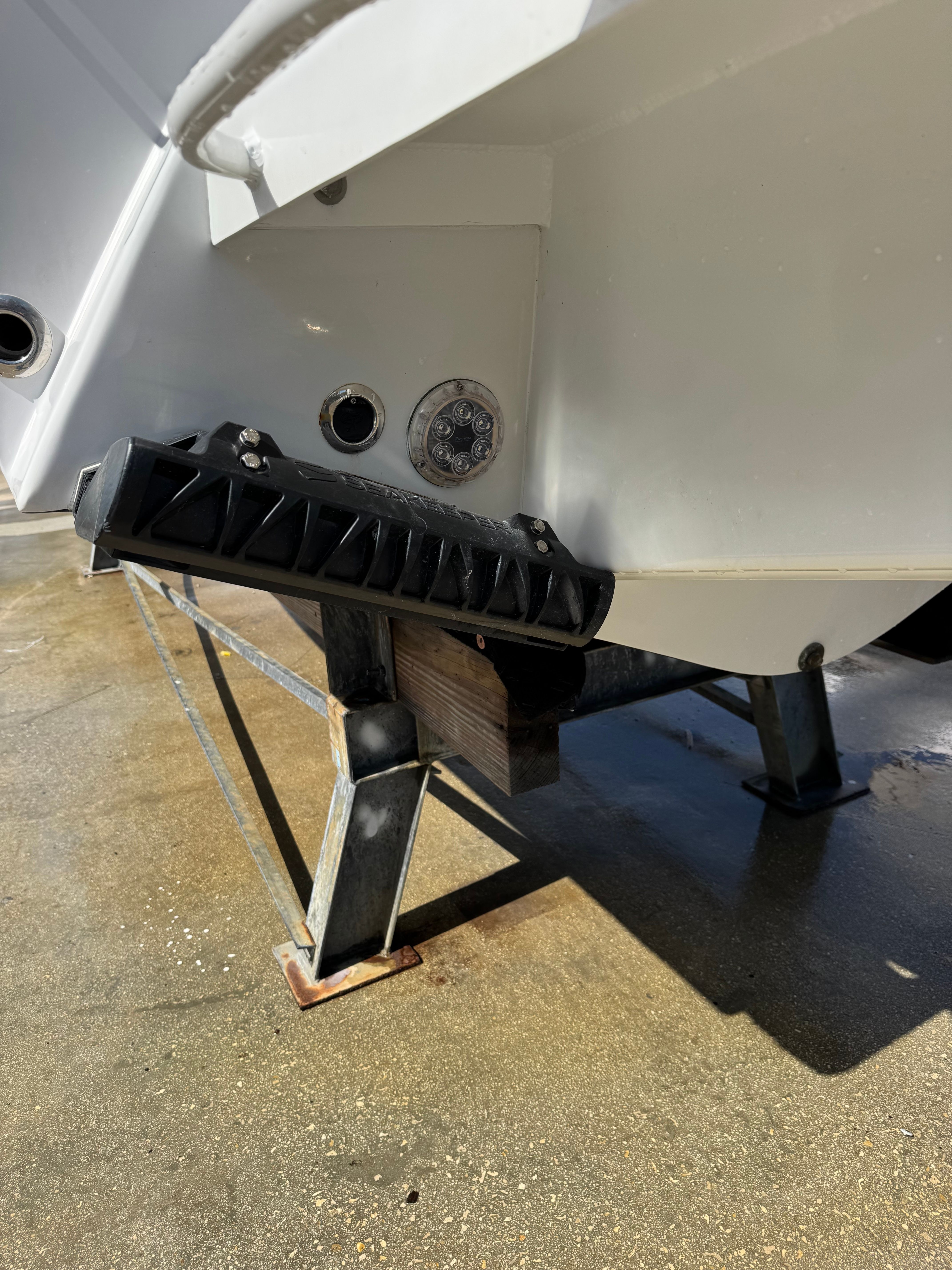 2024 Latitude Tournament Boats 25' CC on stand, rear detail view.