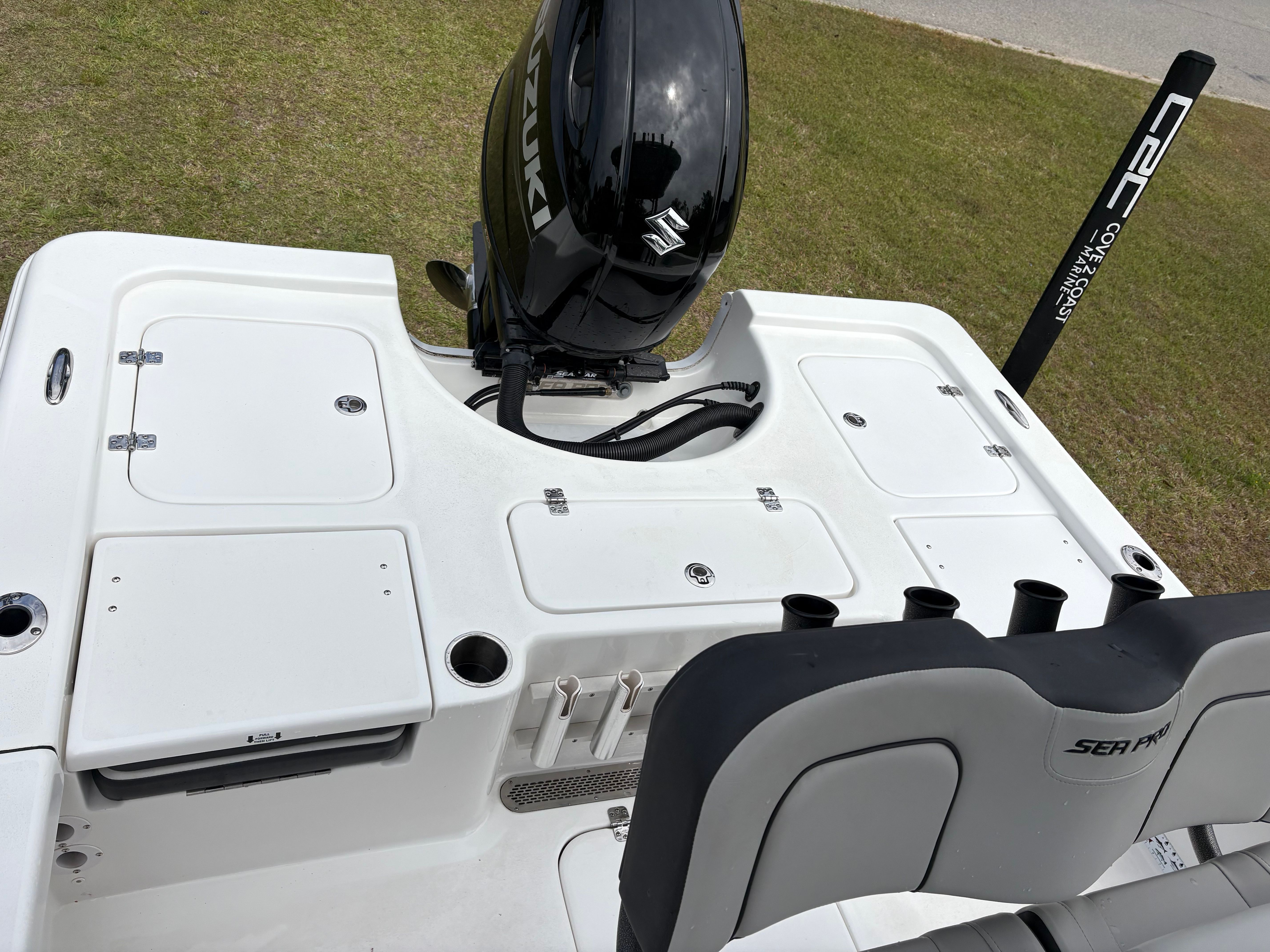 Rear view of a 2025 Sea Pro 230 Bay boat with Suzuki engine.