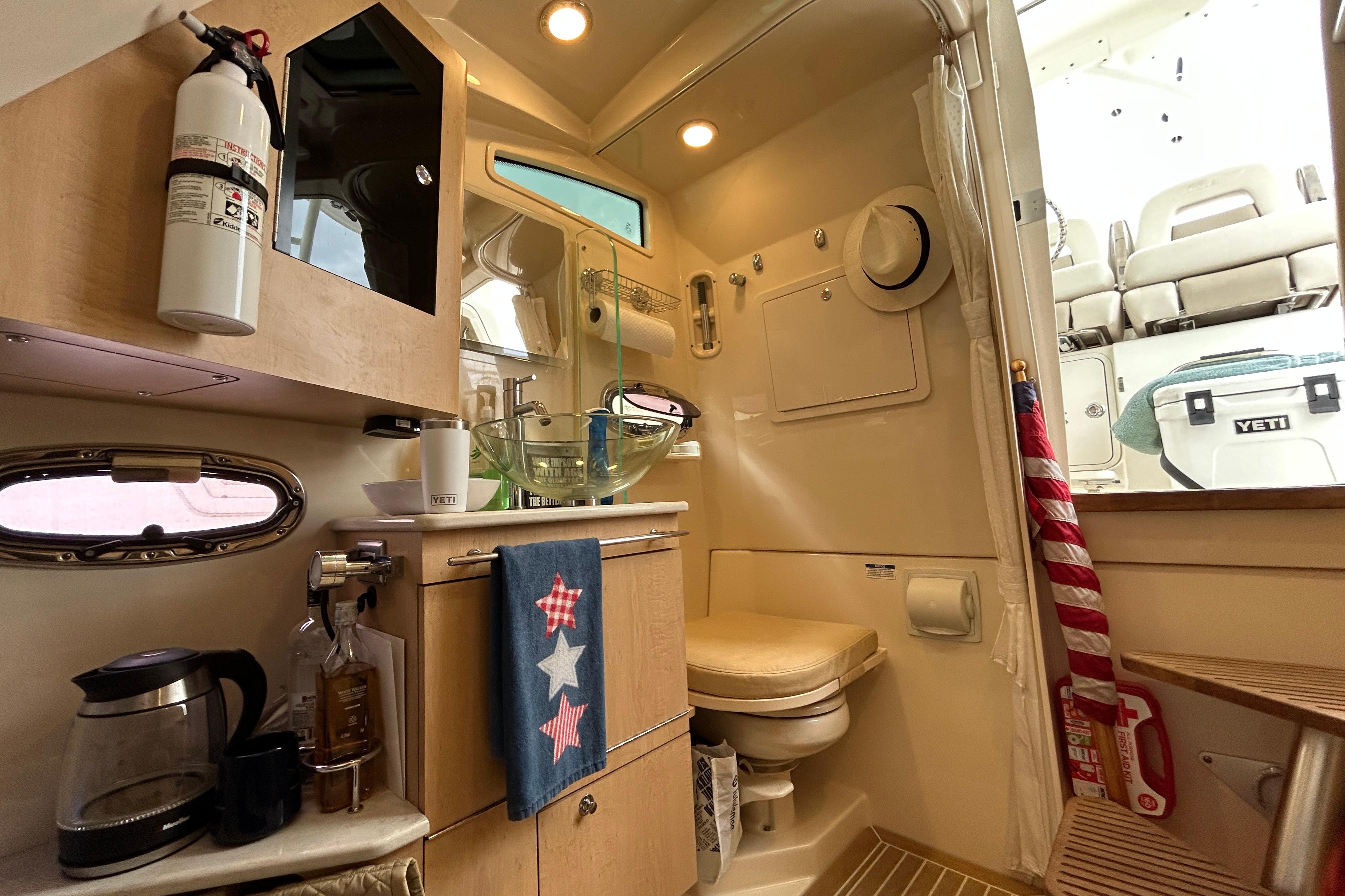2017 Boston Whaler 370 Outrage cabin with modern amenities and stylish interior design.