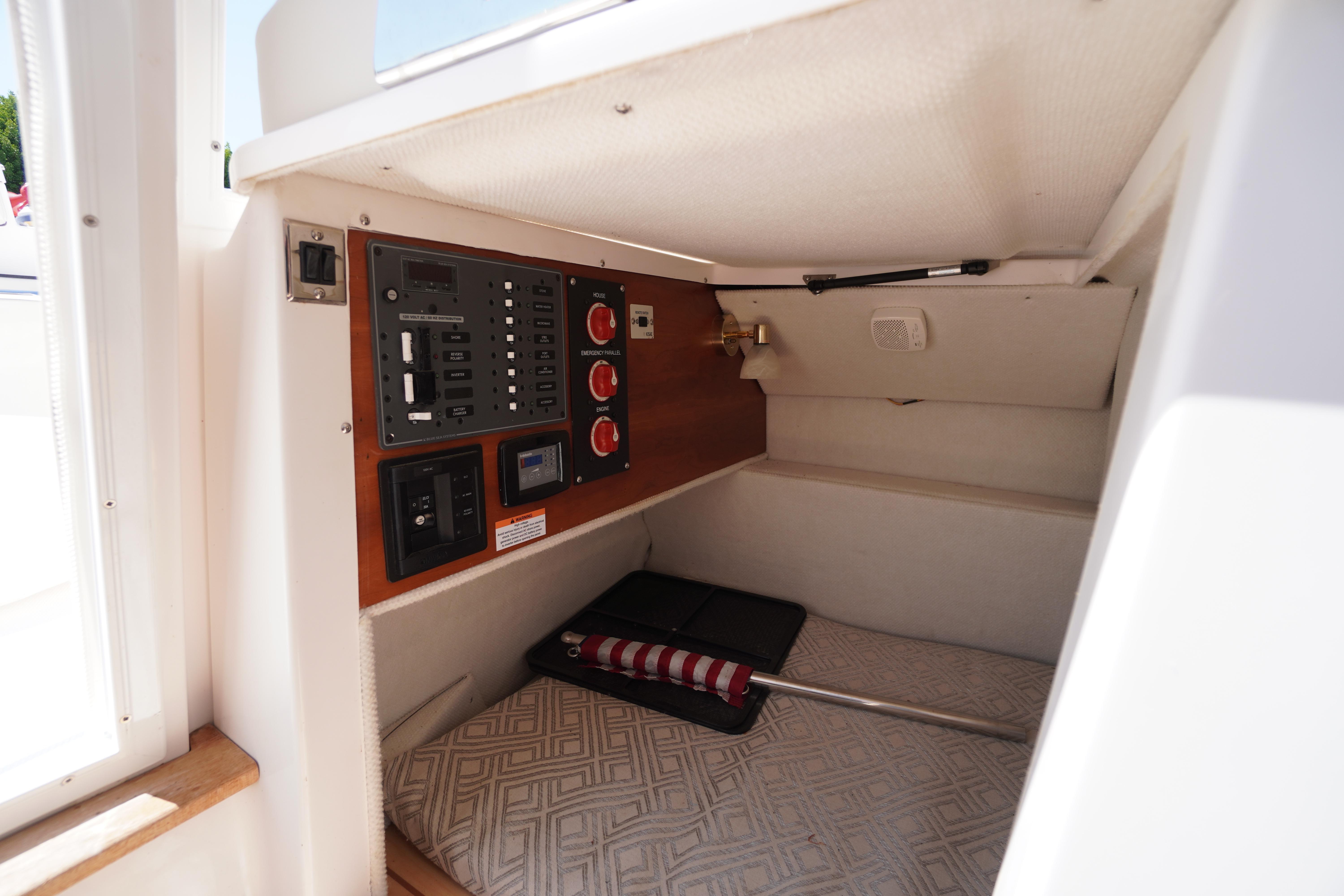 2019 Cutwater C-242 Sport Coupe cabin interior with control panel and storage area.