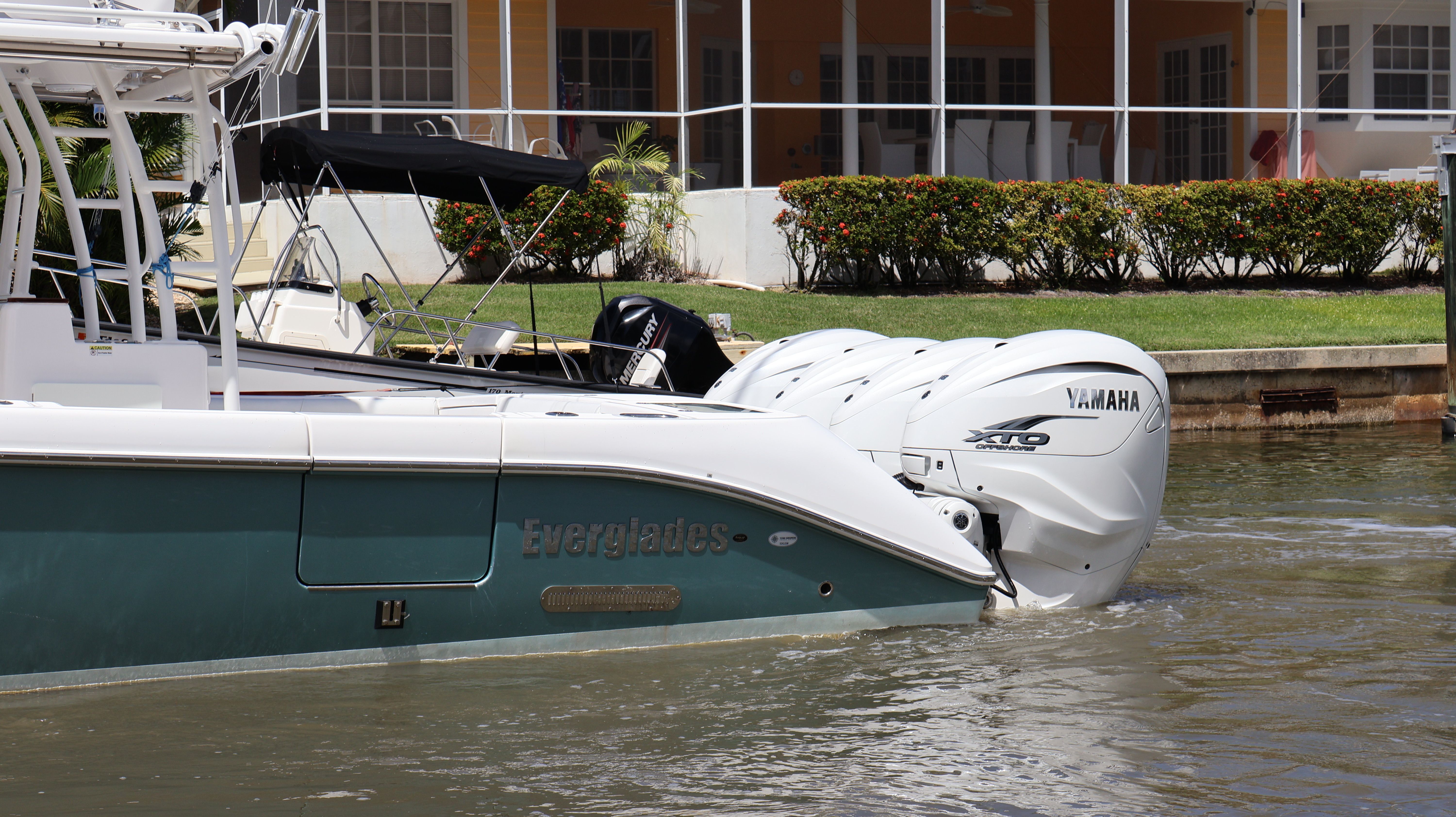 Everglades 435 Center Console 2019 with Yamaha engines in water.