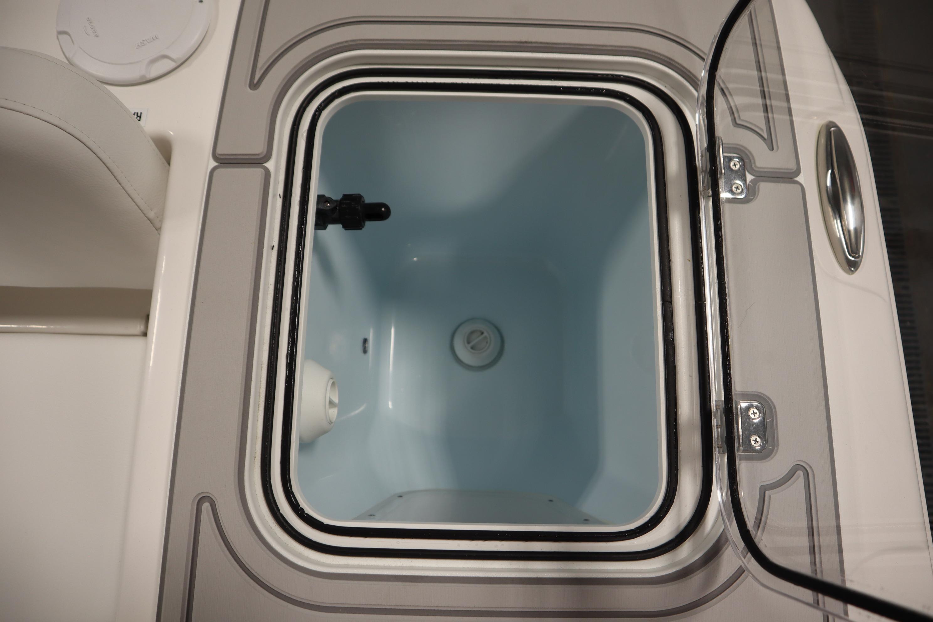 Livewell compartment on a 2026 Sea Fox 228 Commander boat, open lid view.