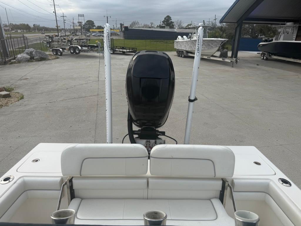 2017 ShearWater 270 Carolina Flare boat with outboard motor in a parking area.