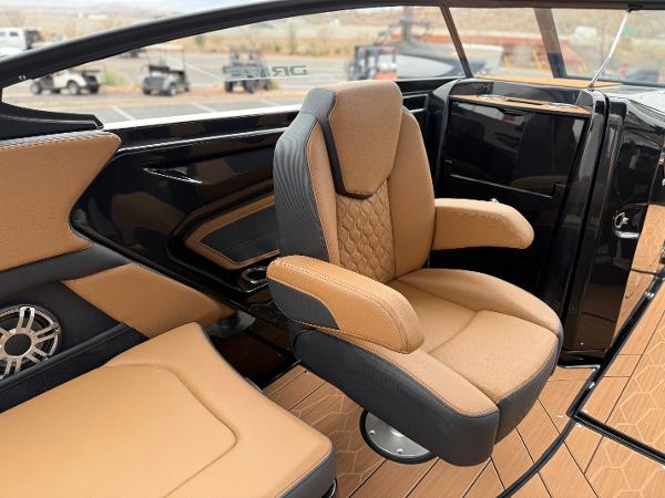 2025 Yamaha Boats 255XD interior with tan and black seating, modern design.