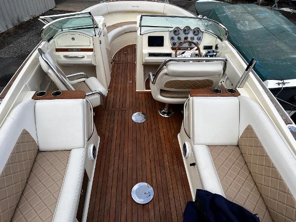 2014 Chris-Craft 28 LAUNCH boat interior with luxurious seating and wooden flooring.