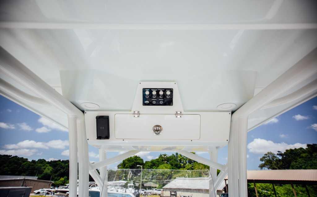 2021 Sea Fox 248 Commander boat console with control panel under clear sky.