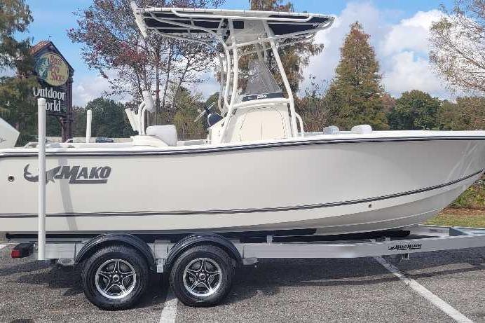 2026 Mako 214 Center Console boat on trailer, parked outdoors.