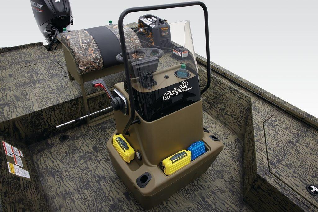 2026 Tracker GRIZZLY® 2072 CC Sportsman boat interior with camouflage design and control console.