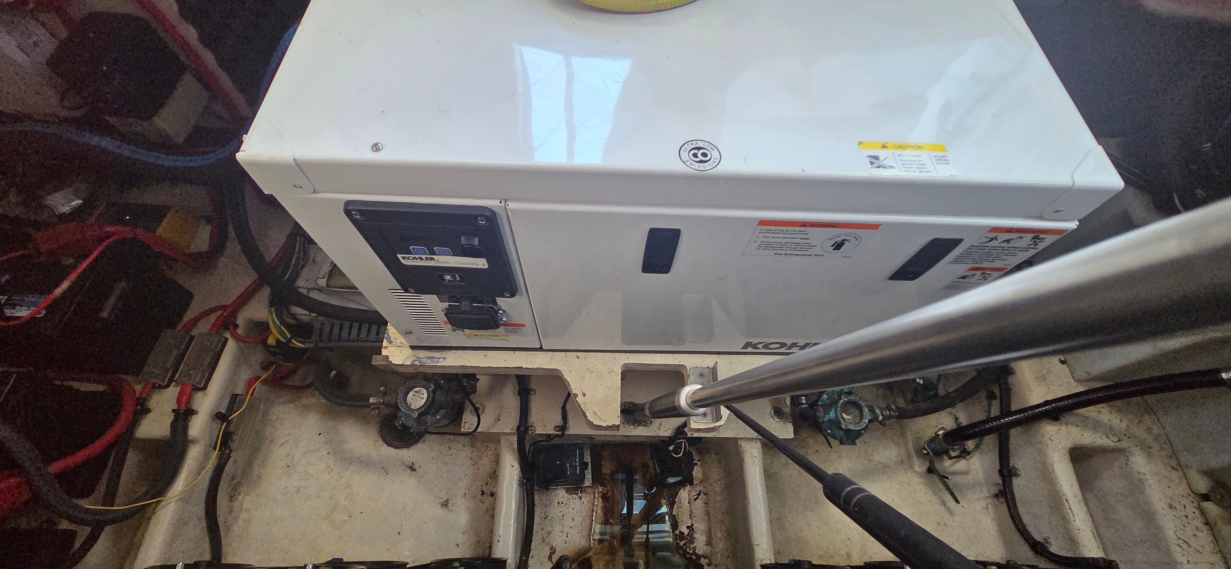 Engine room of a 2012 Bayliner 335 Cruiser with generator.