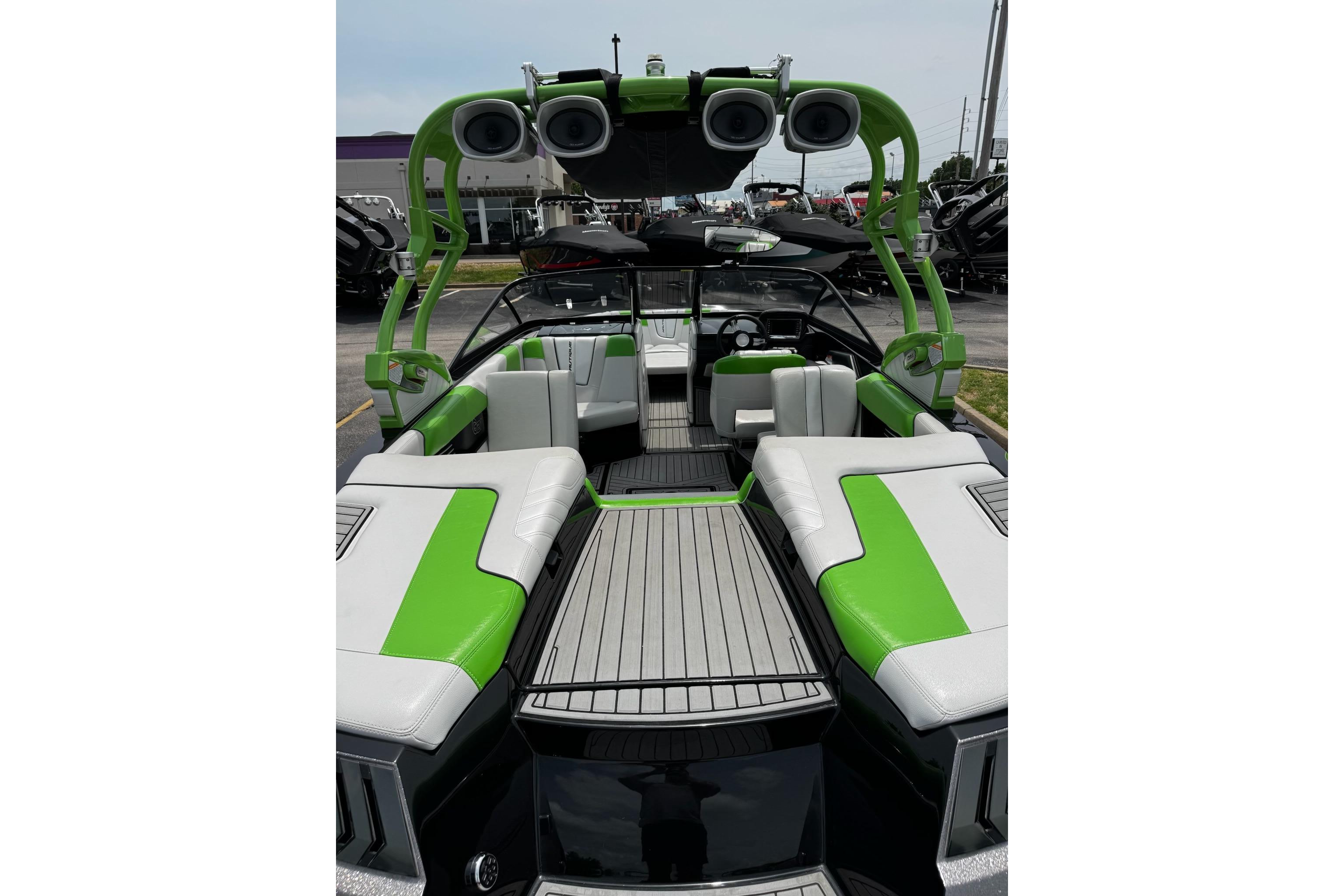 2014 Nautique Super Air Nautique G21 boat interior with green and white seating.