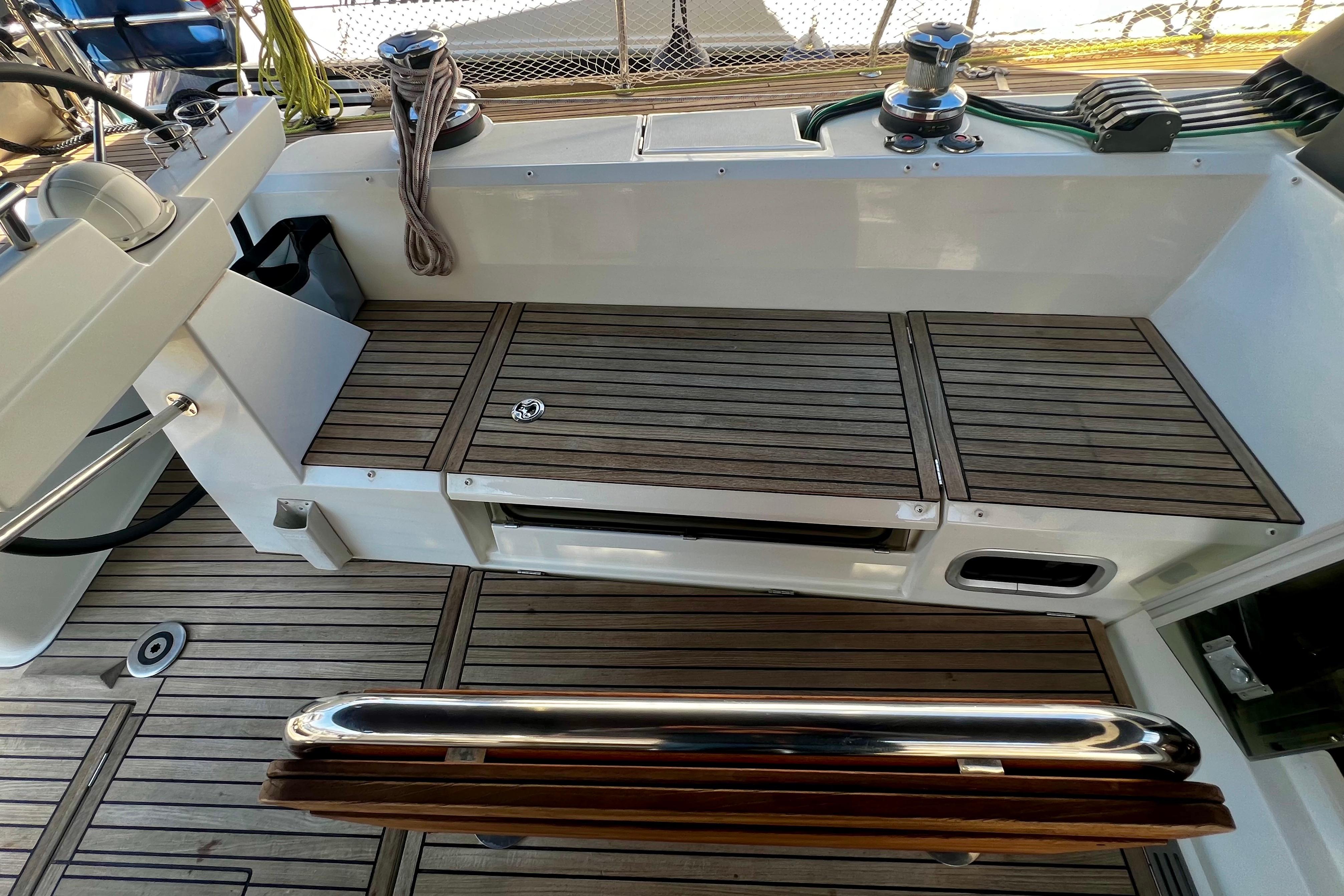 2018 Beneteau Sense 51 yacht deck with teak flooring and winch system.