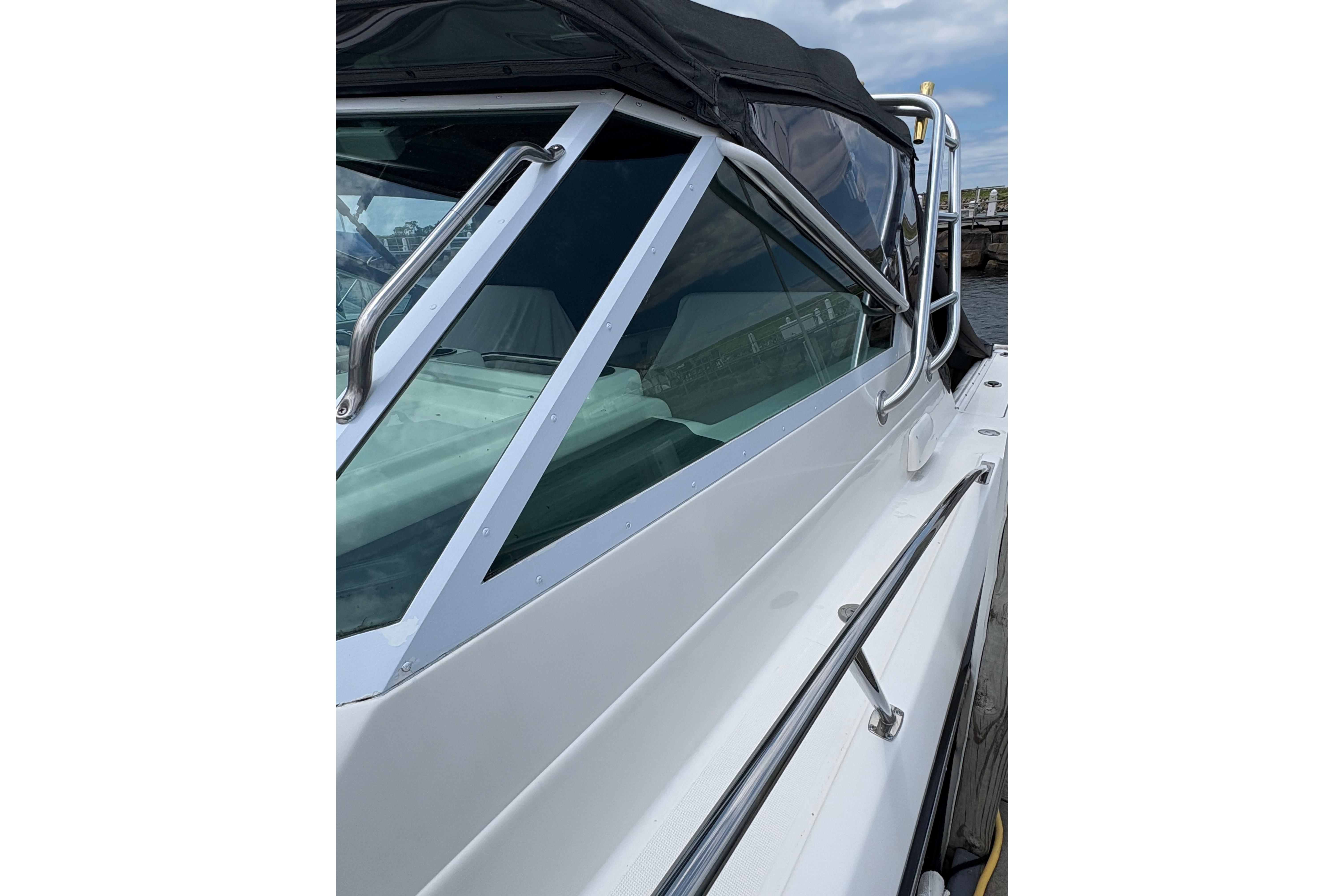 1999 Tiara Yachts 3100 Open boat with sleek design and sturdy railings.