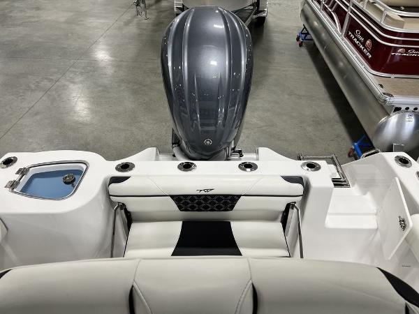 Tidewater 232 CC Adventure 2023 with outboard motor and seating area.