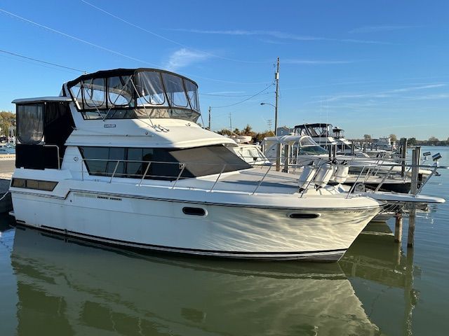1988 Carver 3807 Aft Cabin Motor Yacht docked at marina.