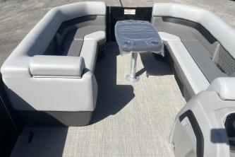 2026 Princecraft Vectra 23 L pontoon boat interior with gray seating and table.
