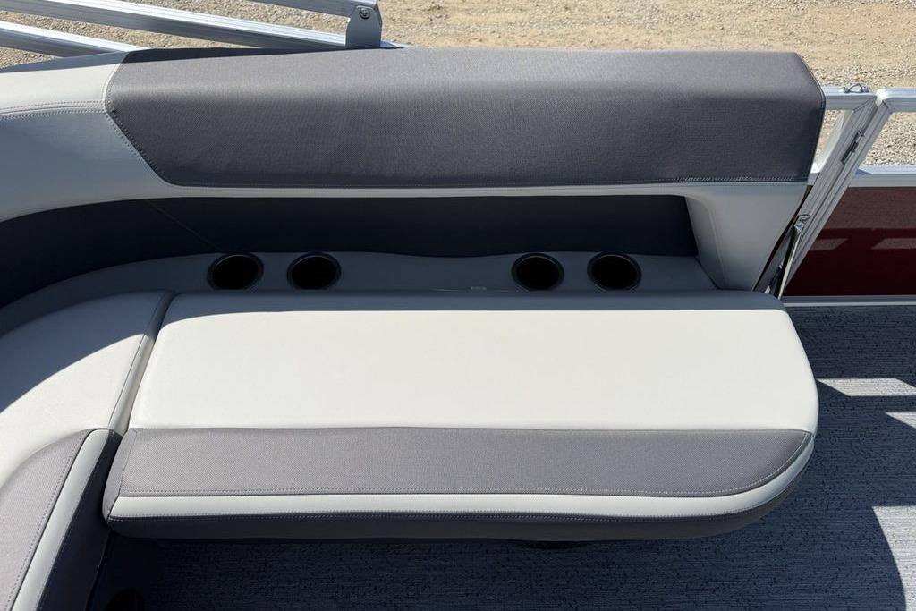 2026 Sun Tracker Bass Buggy 18 DLX boat seat with cup holders, gray upholstery.