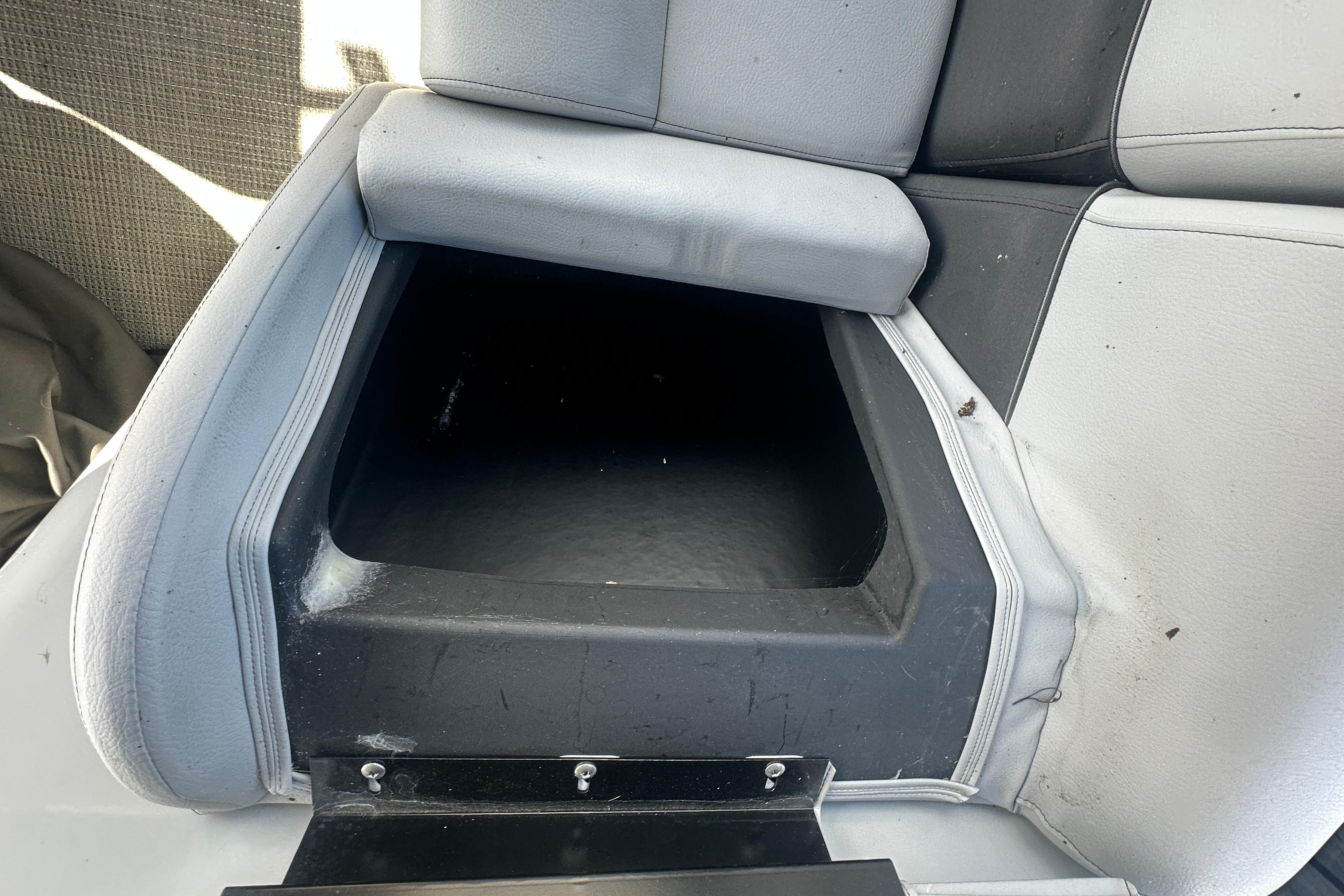2023 Bentley Pontoons Legacy 243 Swingback seat storage compartment, open and empty.