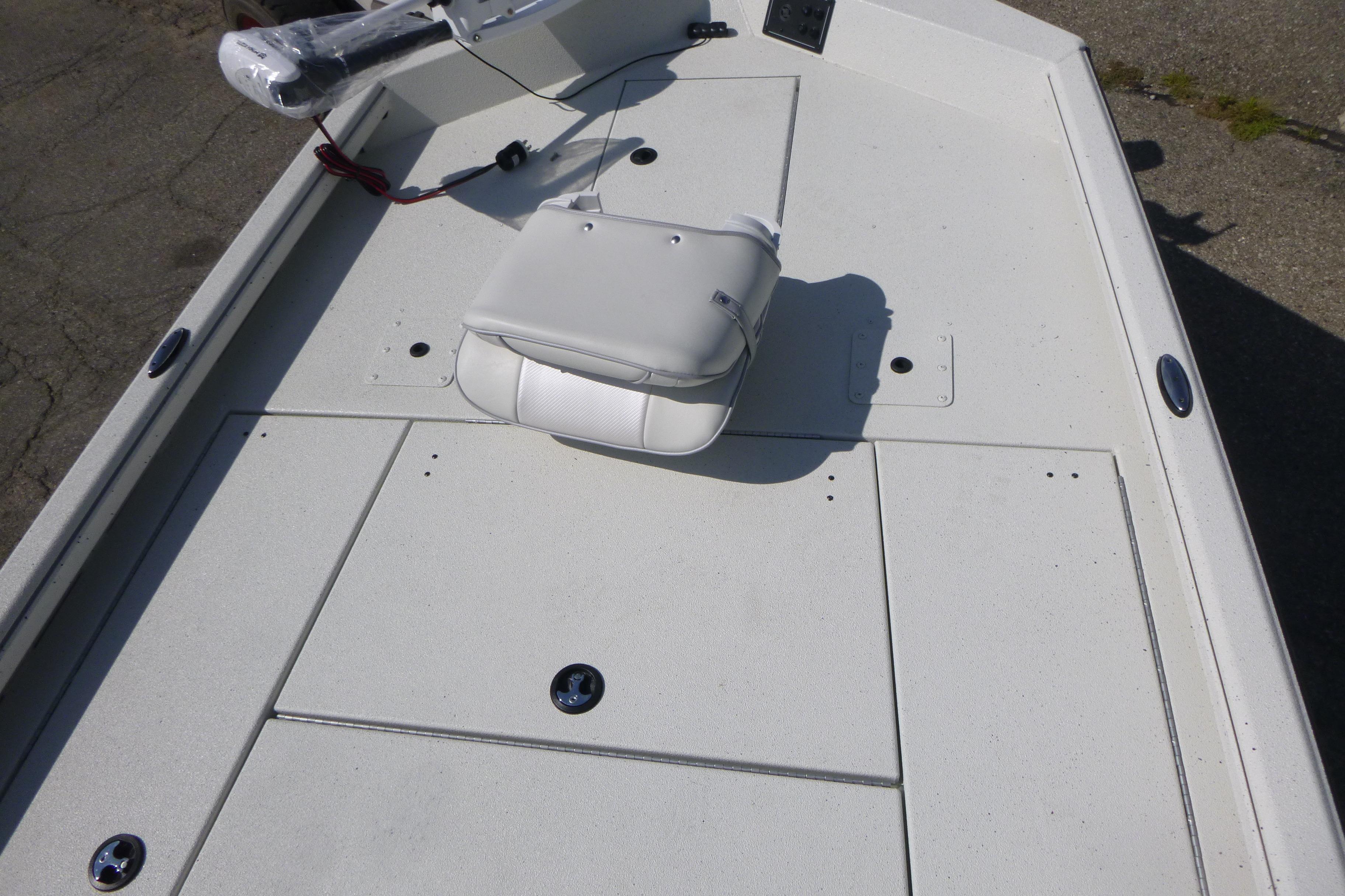 2025 Ranger RB210 boat deck with white seating and storage compartments.