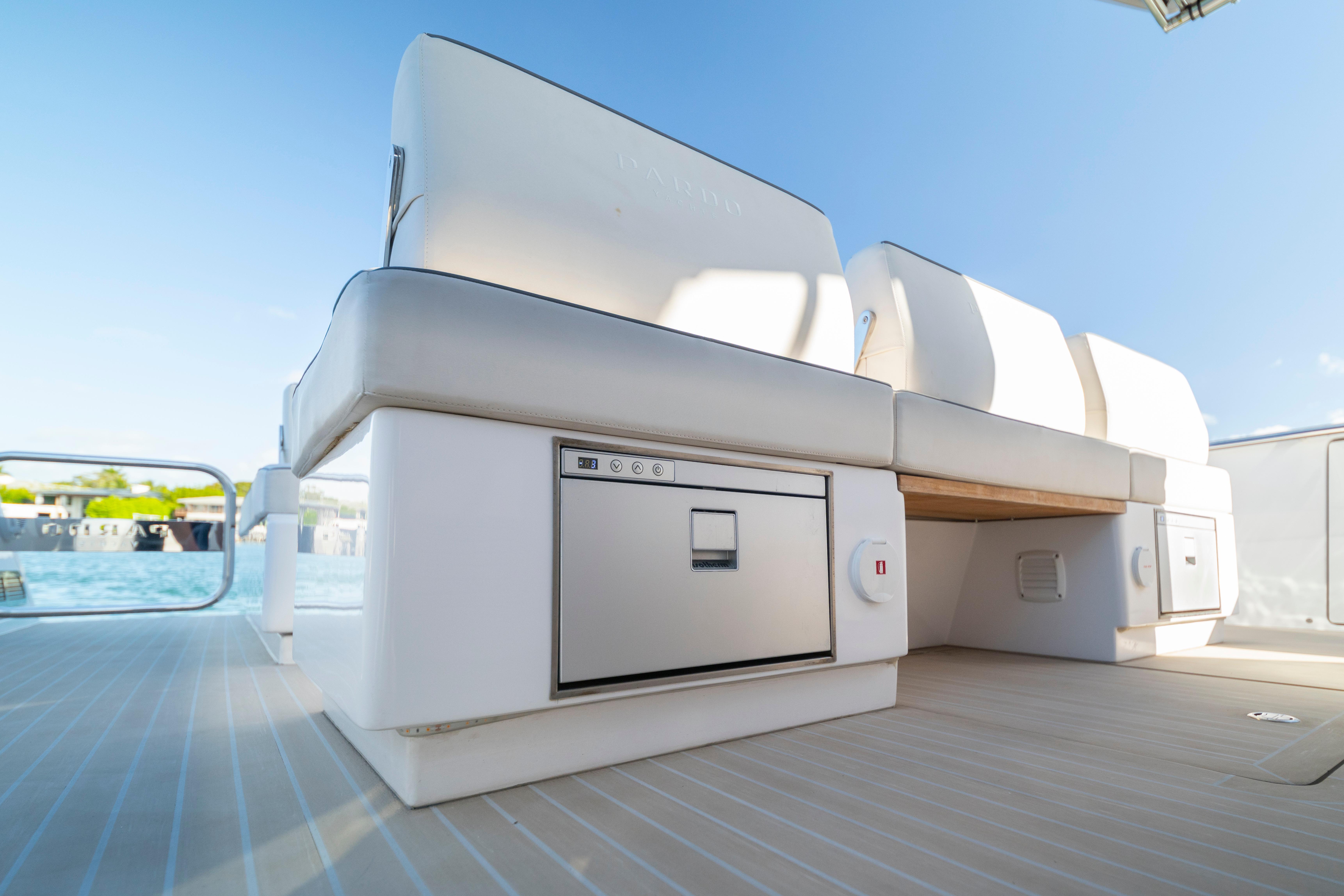 2024 Pardo Yachts P43 interior with sleek seating and built-in storage, dockside view.