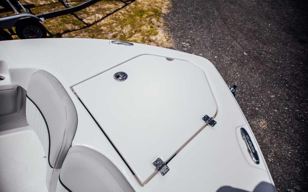 2021 Sea Fox 248 Commander boat deck with storage compartment and seating.
