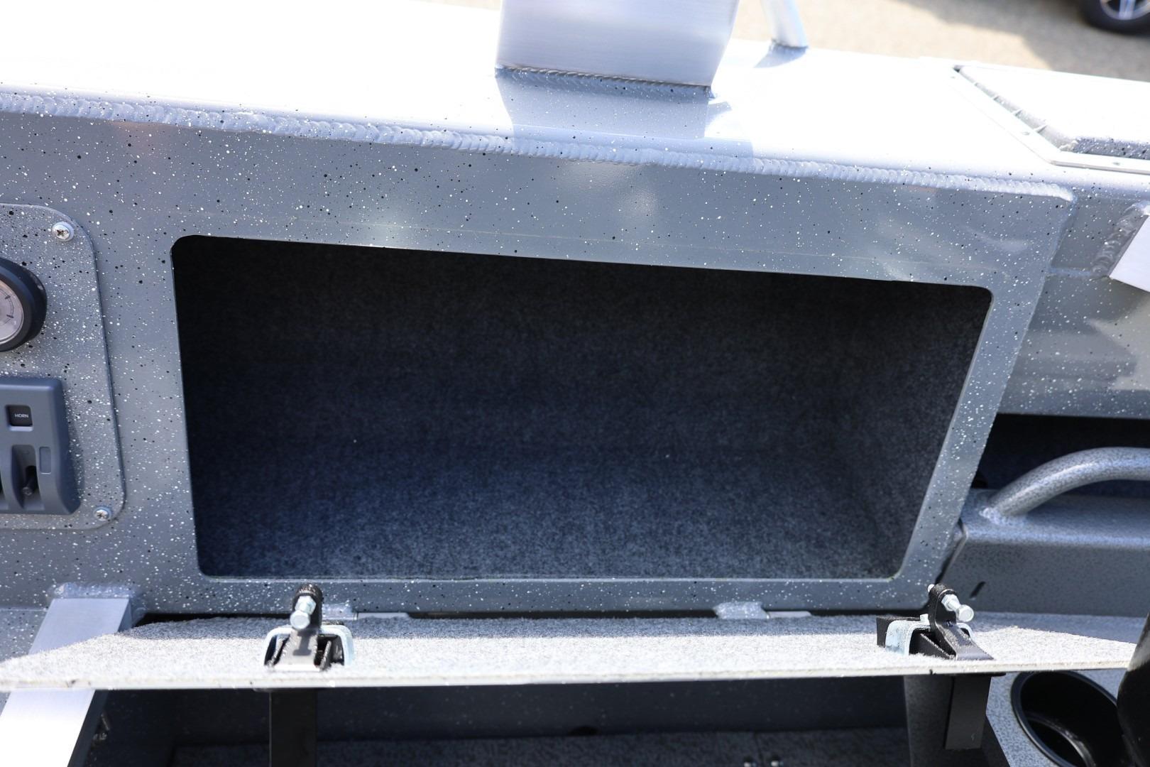 Storage compartment of 2026 Thunder Jet 209 Rush OT boat, featuring a speckled finish.