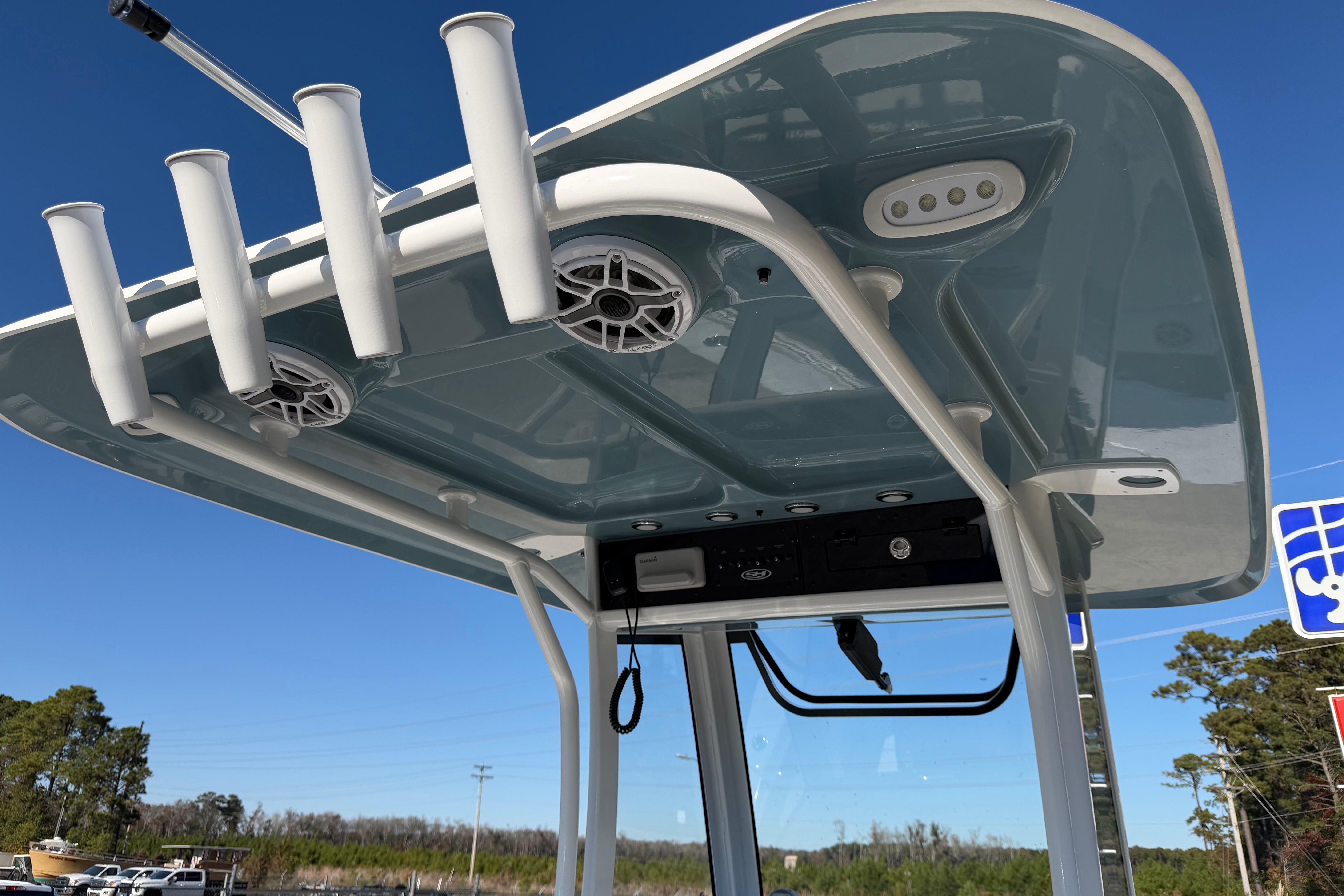 T-top of 2026 Sea Hunt Ultra 275 Coffin Box with rod holders and speakers.