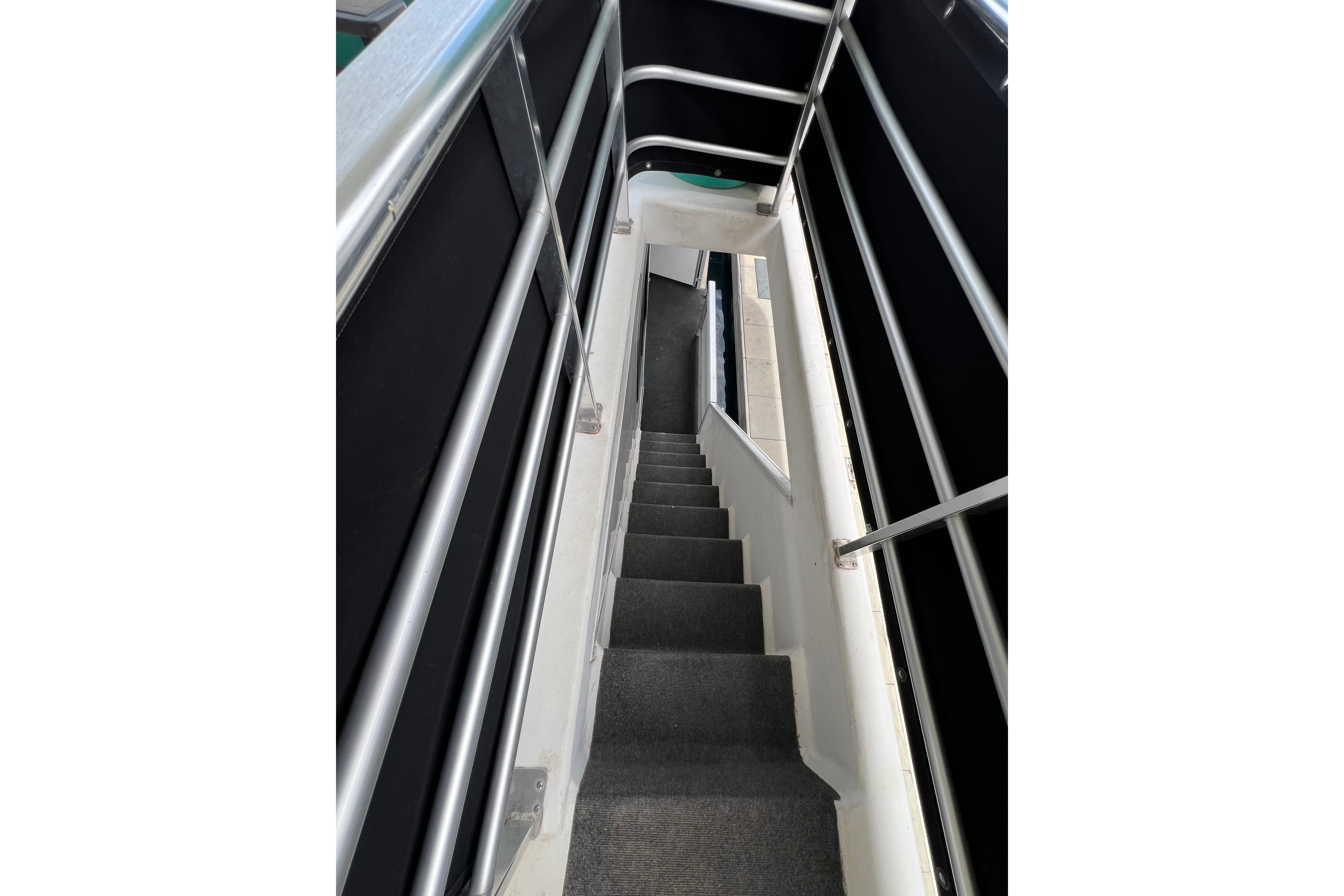 Staircase on 2013 Destination Yacht Lotta Yachta, featuring sleek metal railings.
