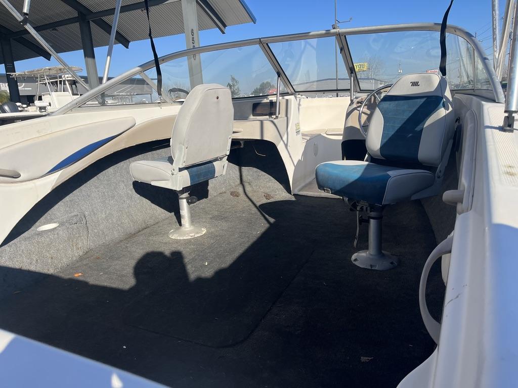 Interior of a 2004 Bayliner 175 boat with two seats.