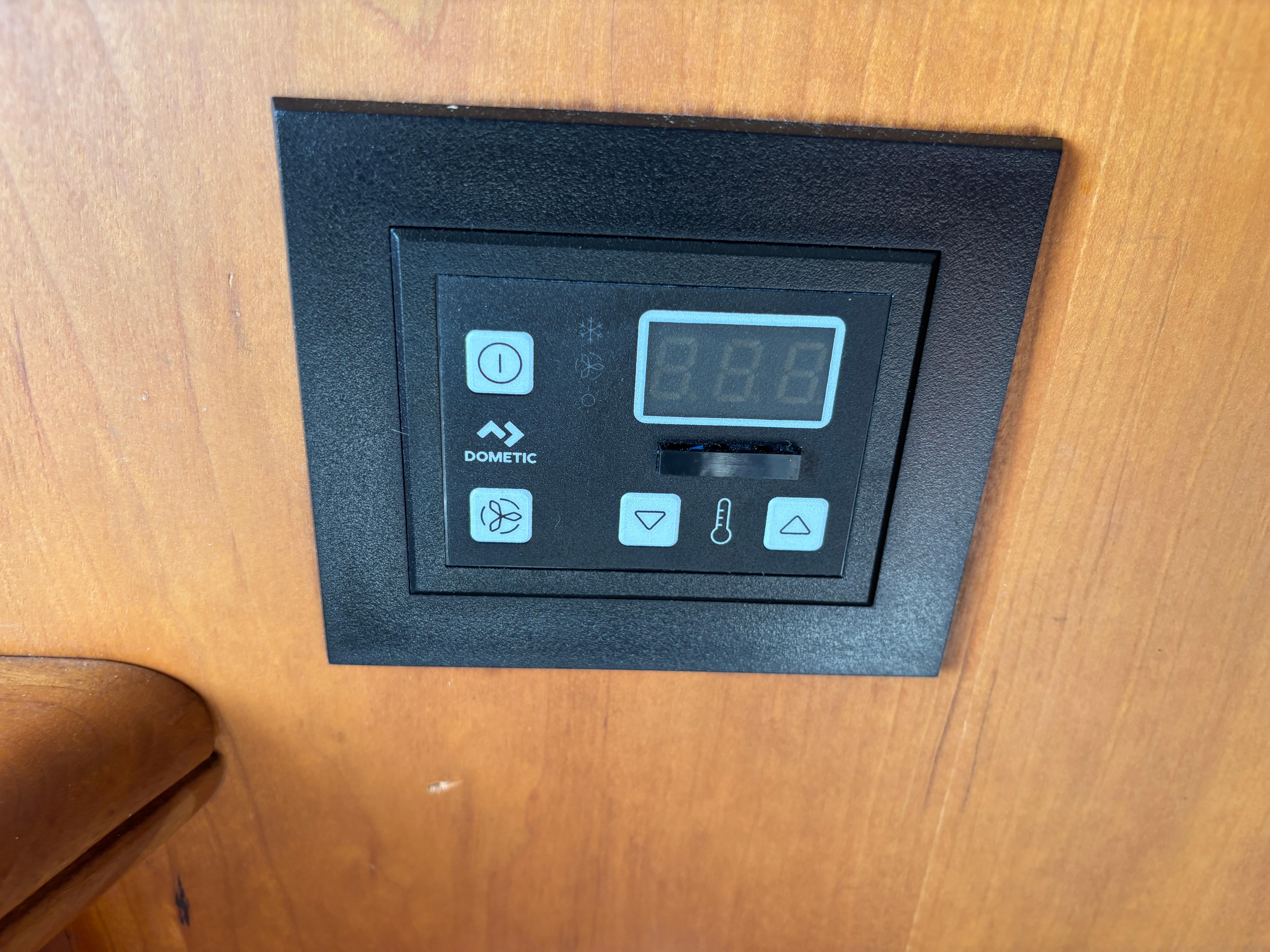 Control panel on 2001 Silverton 410 Sport Bridge, featuring Dometic display and buttons.
