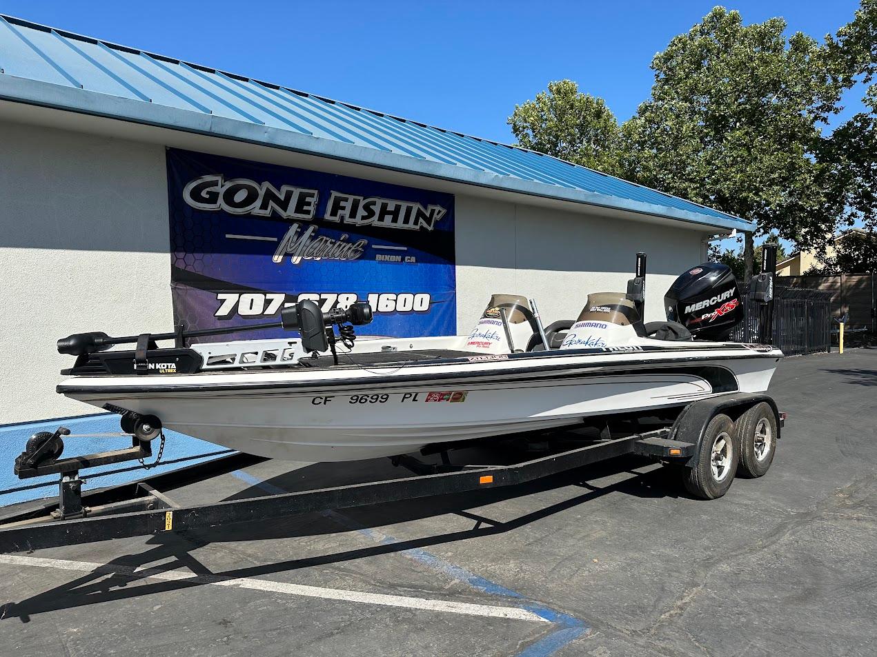 1999 Fisher 21 FX DC boat on trailer at Gone Fishin' Marine dealership.