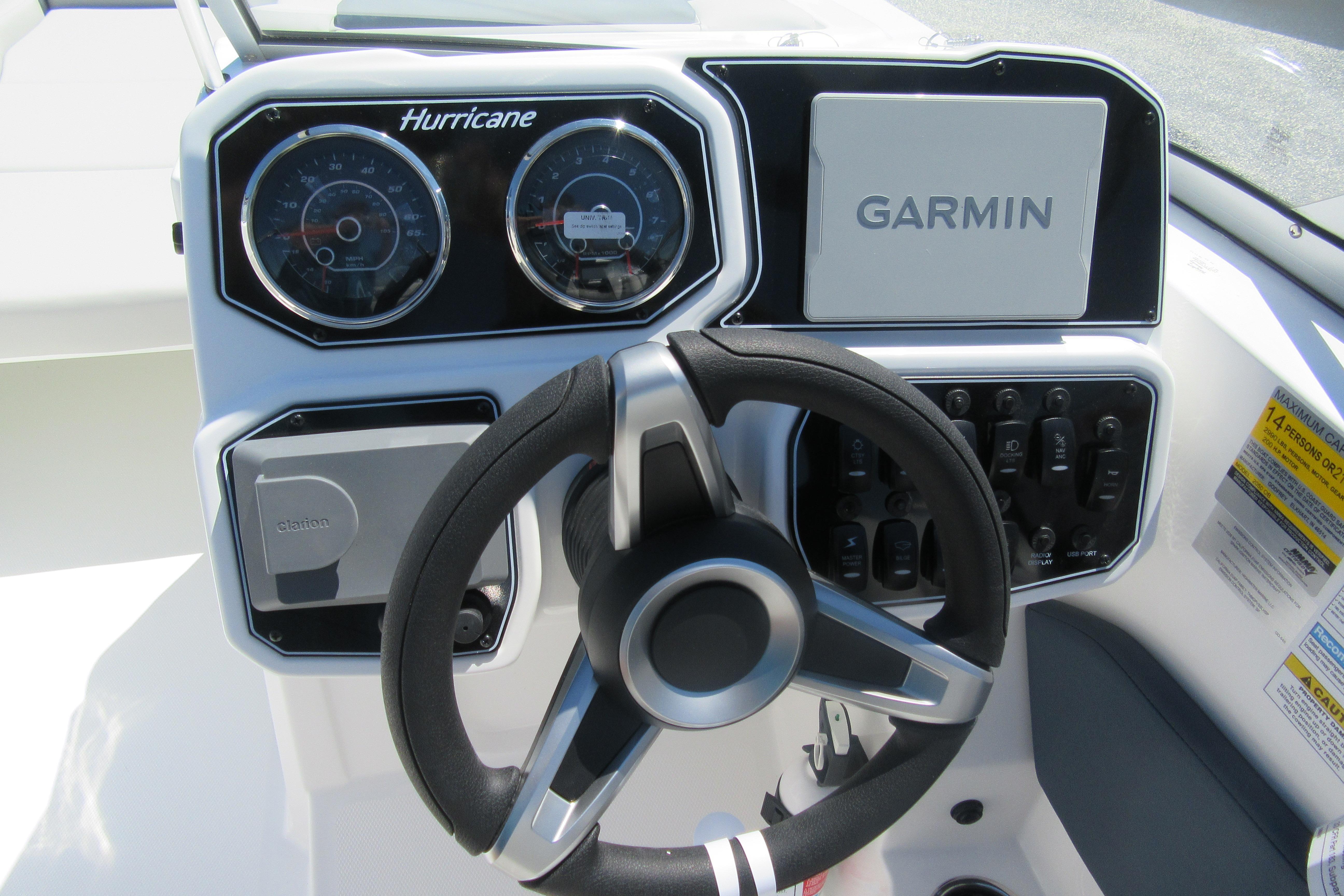 Dashboard of 2027 Hurricane SunDeck 2050 OB boat with Garmin navigation system.