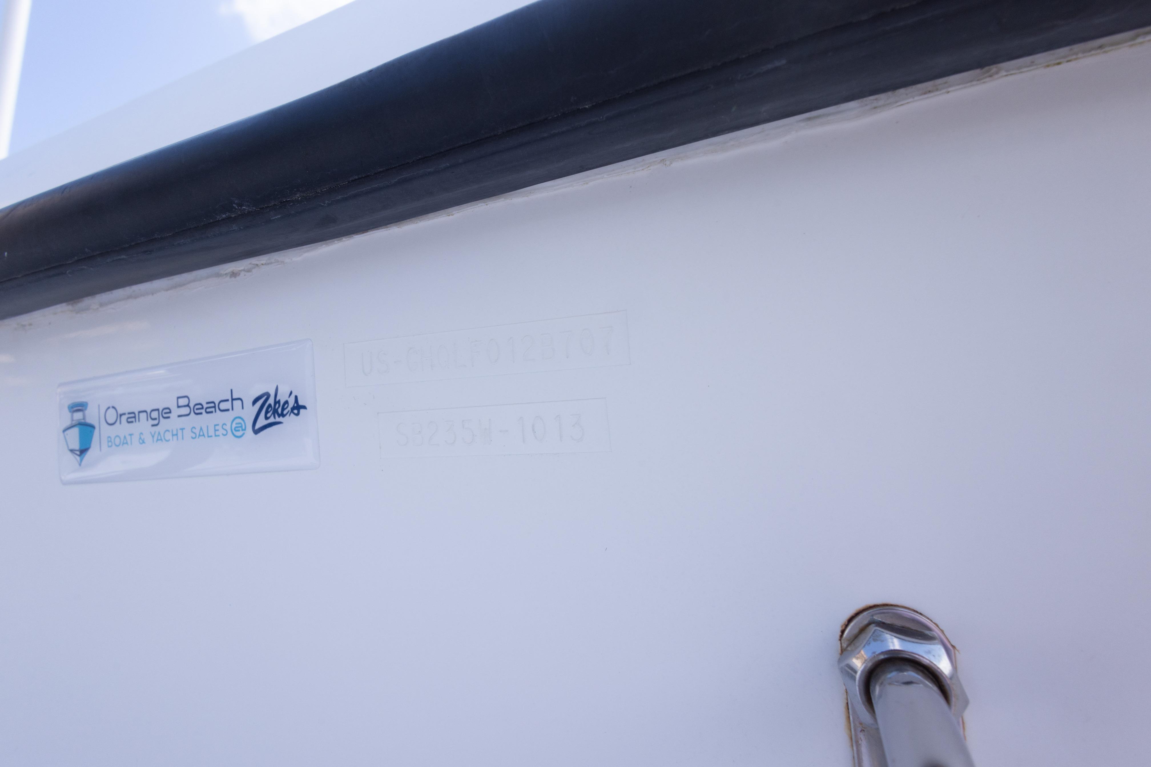 2007 Sea Boss 235 Walkaround boat with Orange Beach sales sticker.