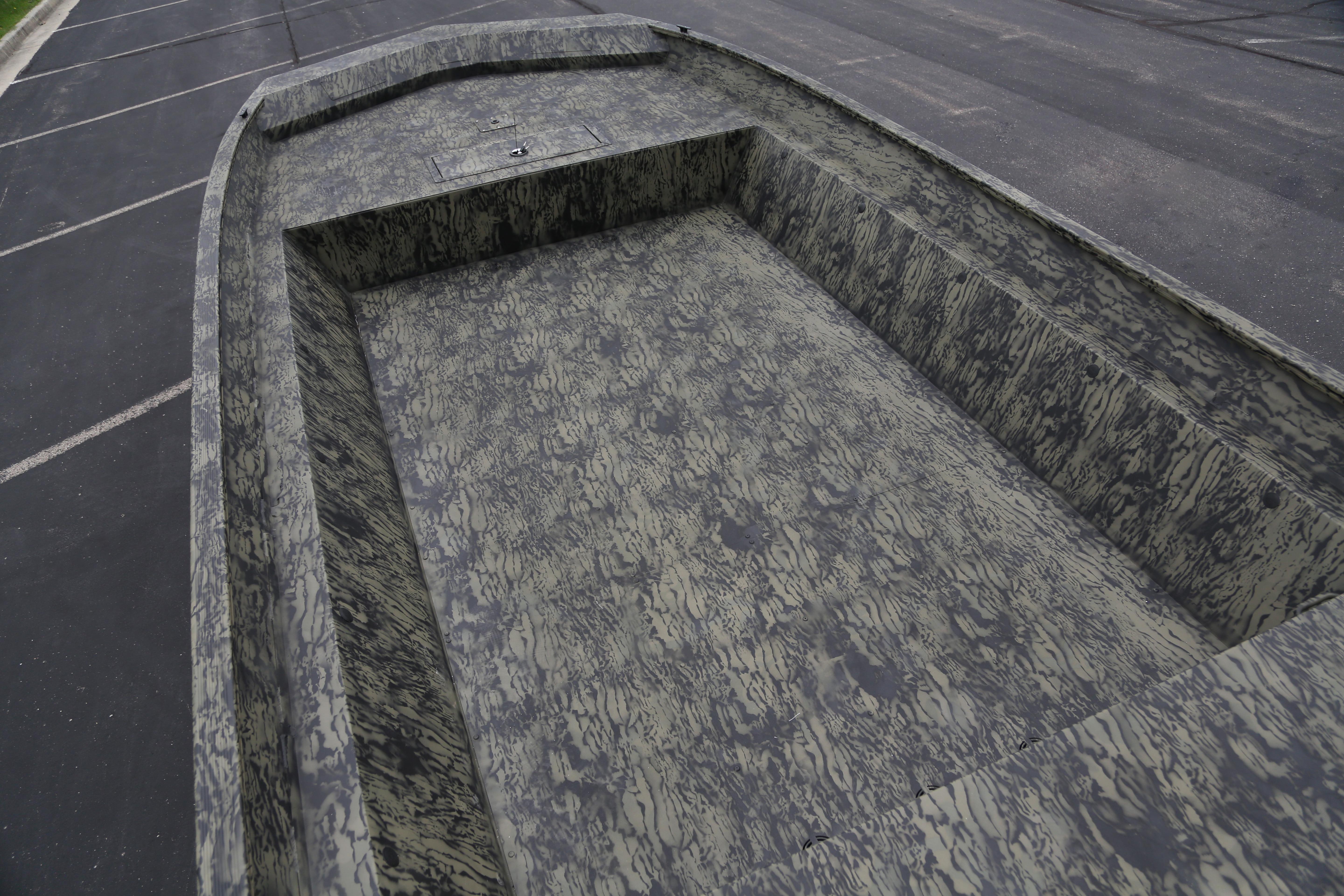 2026 Tracker GRIZZLY 2072 Utility boat with camouflage interior design.