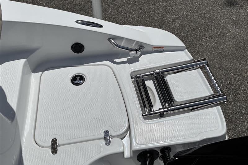 2026 Tahoe 2150 boat swim platform with foldable ladder and storage compartment.