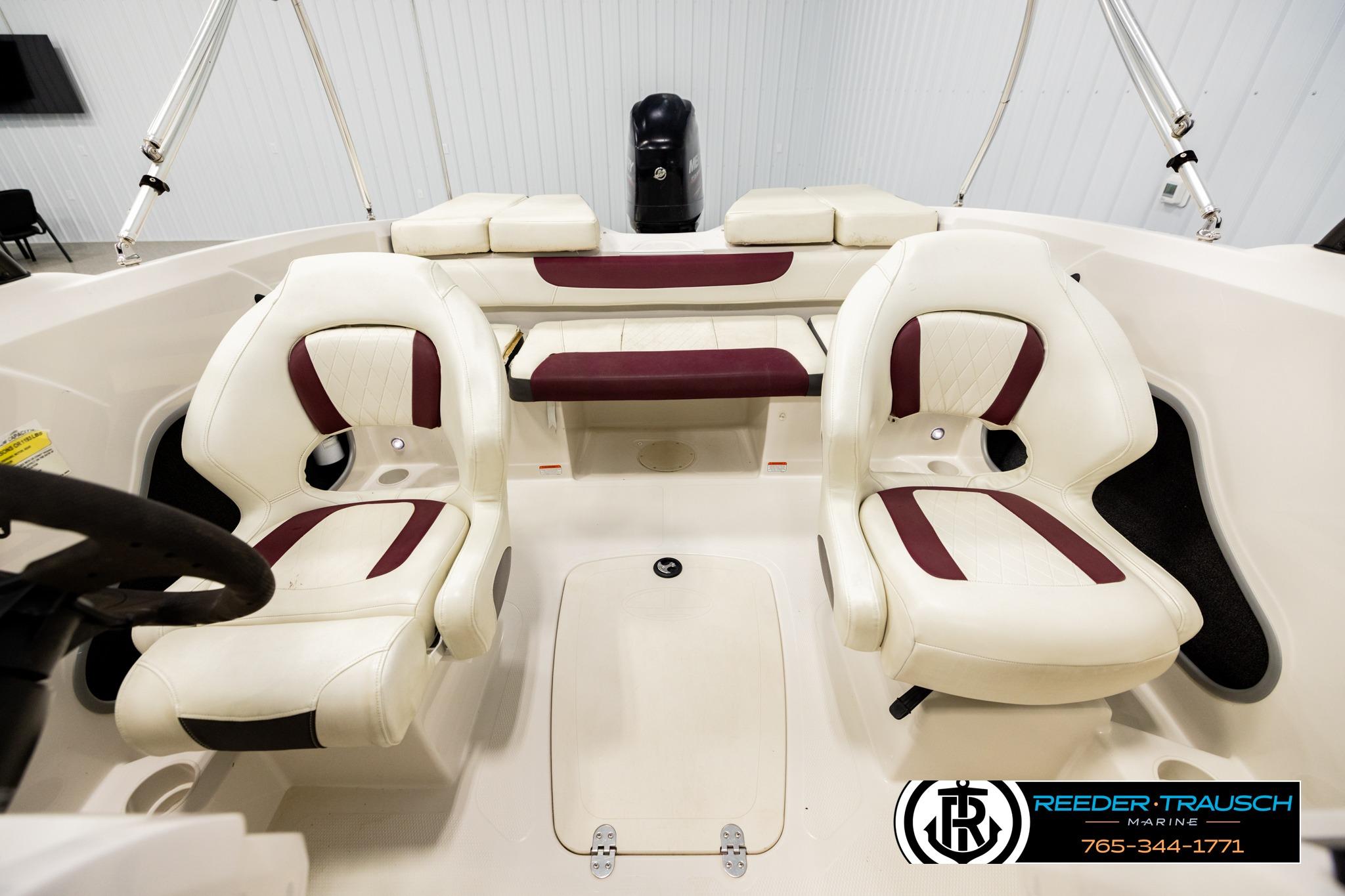 Interior of a 2016 Tahoe 450 TS boat with white and maroon seating.
