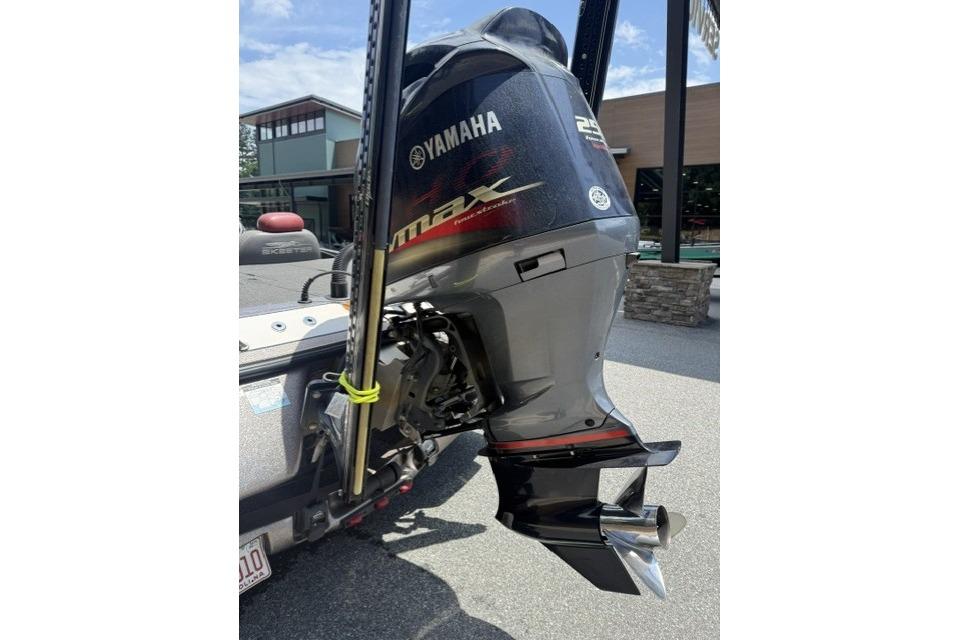 2013 Skeeter FX21 with Yamaha outboard motor in a parking lot.