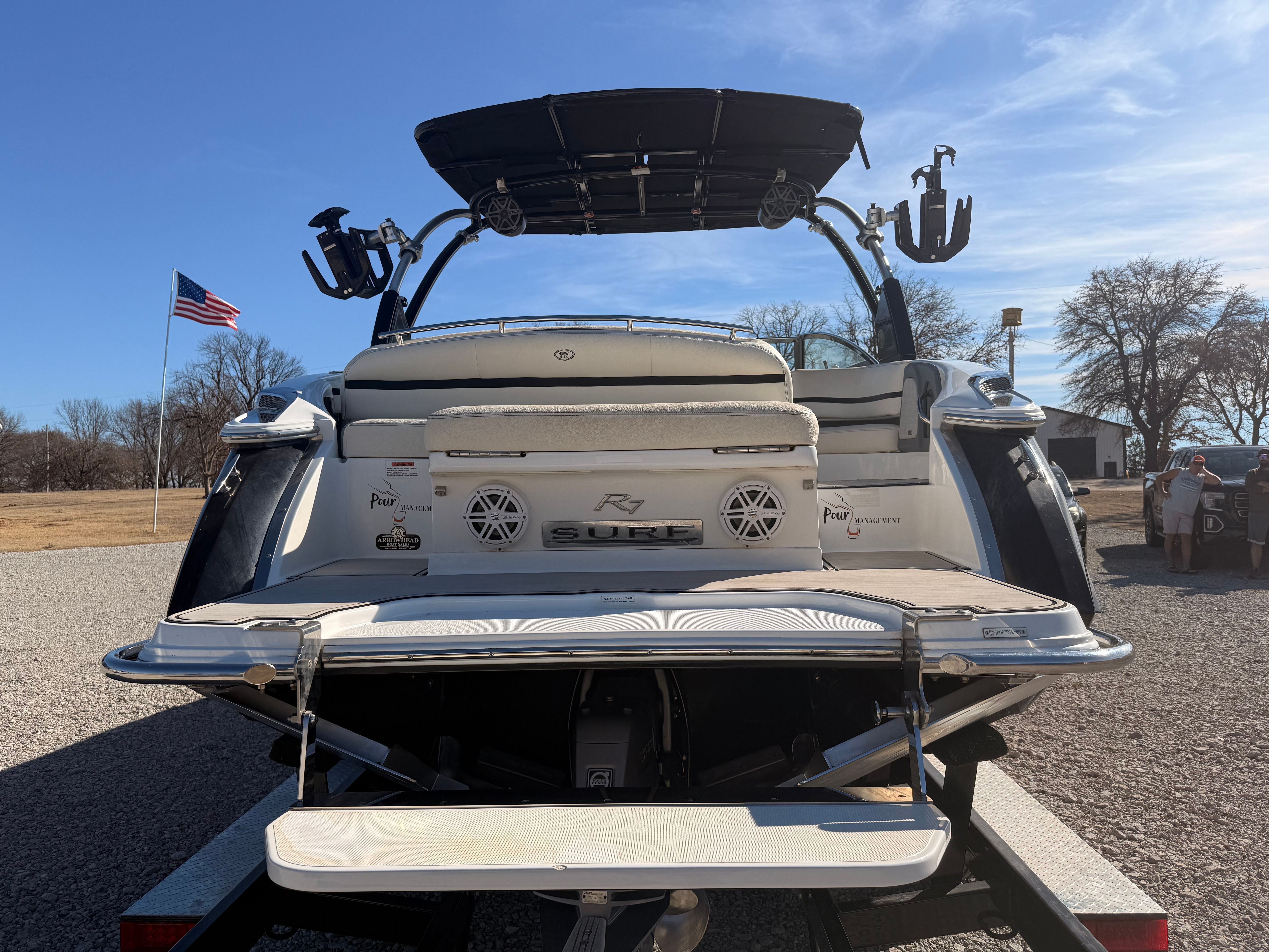 The image shows the rear of a 2019 Cobalt R7 Surf boat with a swim platform.