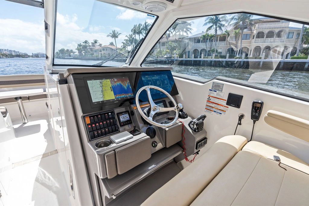 Interior of 2019 Pursuit 365 DC with modern helm console.